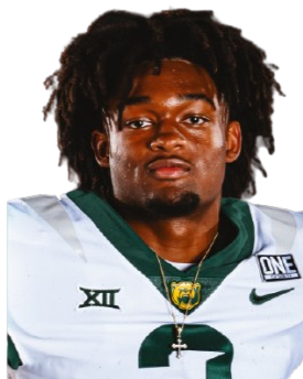 Portrait of a young African American male football player wearing a green and white jersey with the number 2, a gold chain, and dreadlocks.