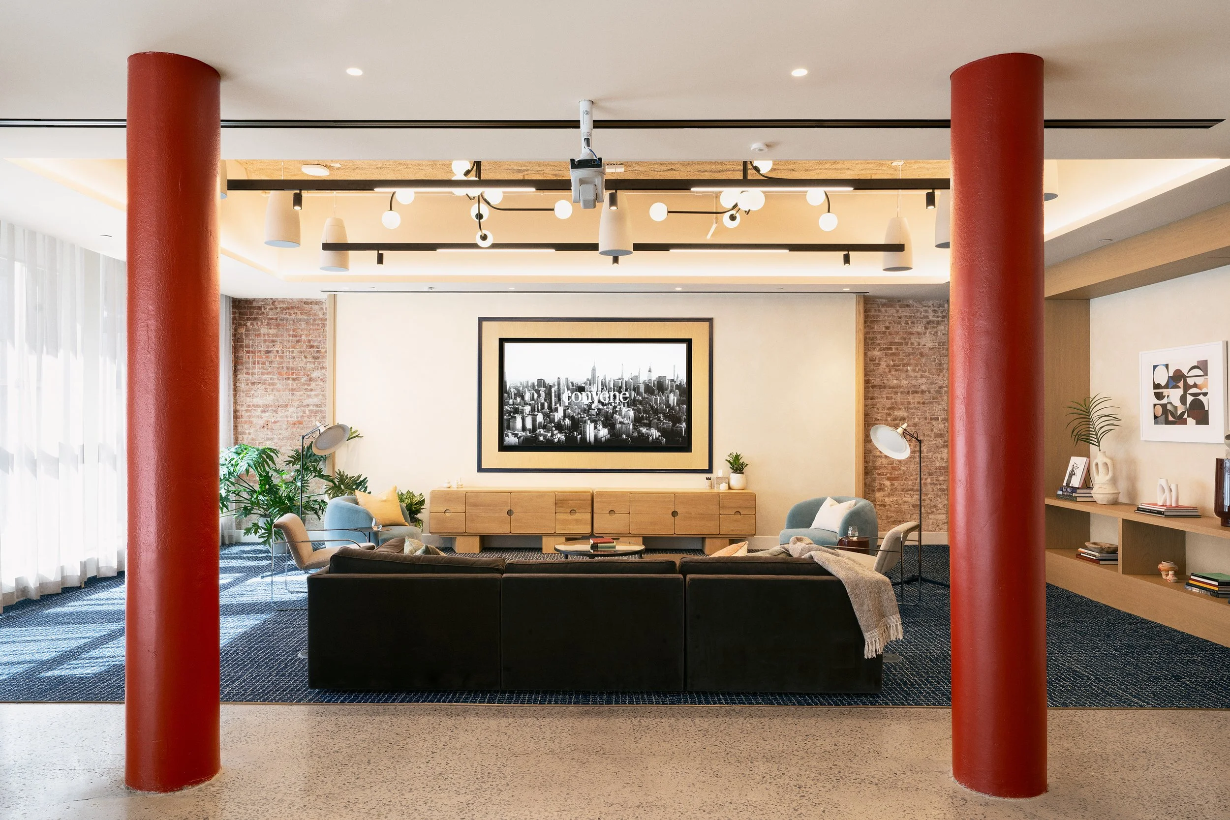 Flex Studio featuring red cast-iron columns and an oak media wall with built-in cabinetry, Scholastic Building SoHo NYC