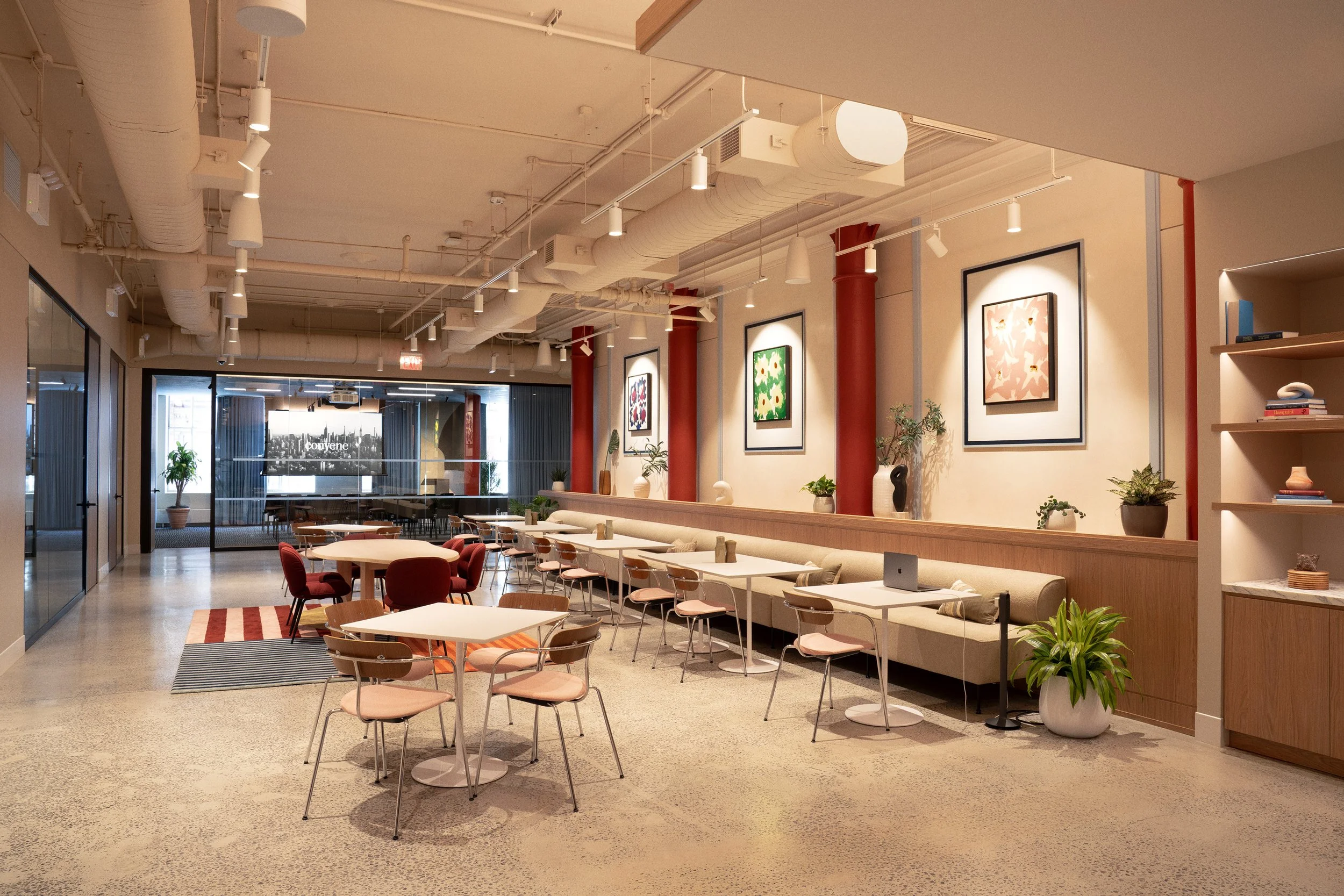 Break Out Space featuring built-in banquette seating and red cast-iron columns, Scholastic Building SoHo NYC