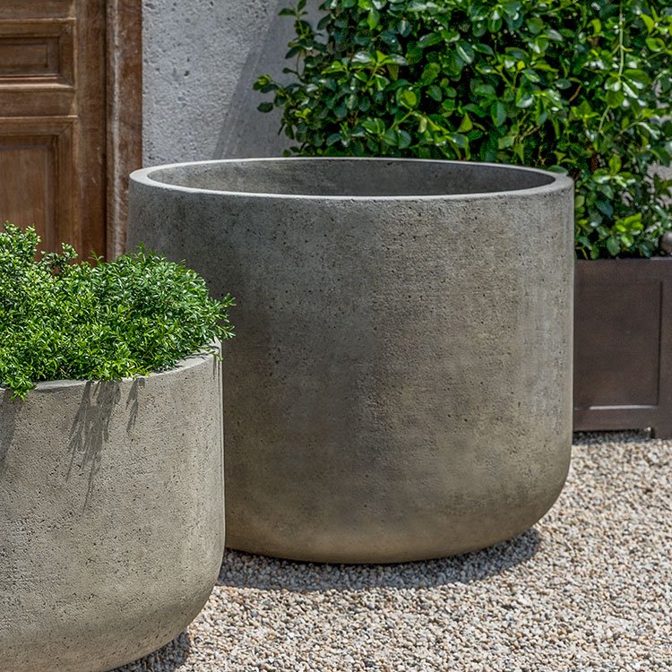 Concrete planters and similar elements create a clean foundation while still offering warmth and texture. Their understated design allows plants and gatherings to take center stage, balancing structure with softness throughout the space.