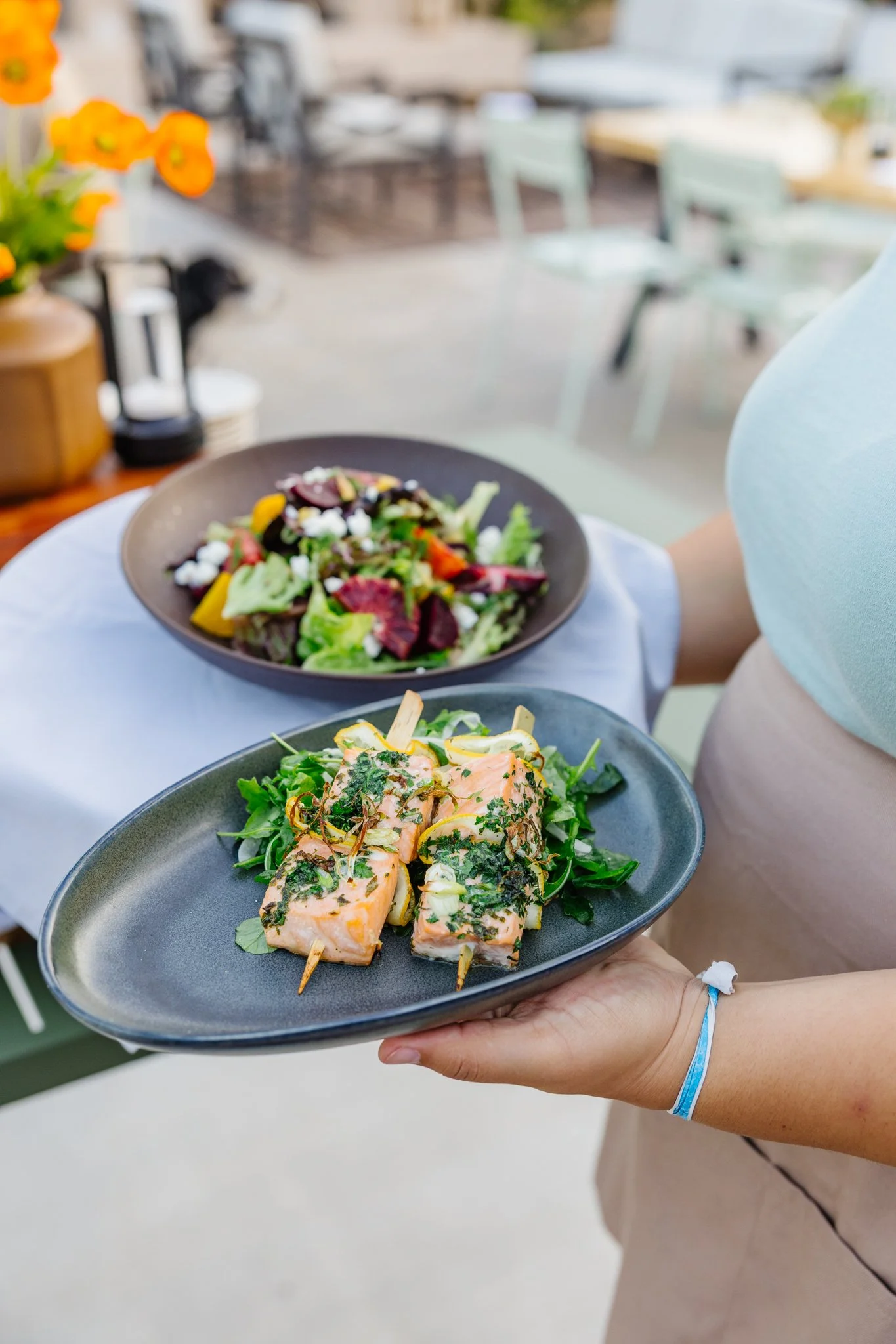 Grilled salmon skewers with seasonal greens served at The Patio at Palomino in Ventura.