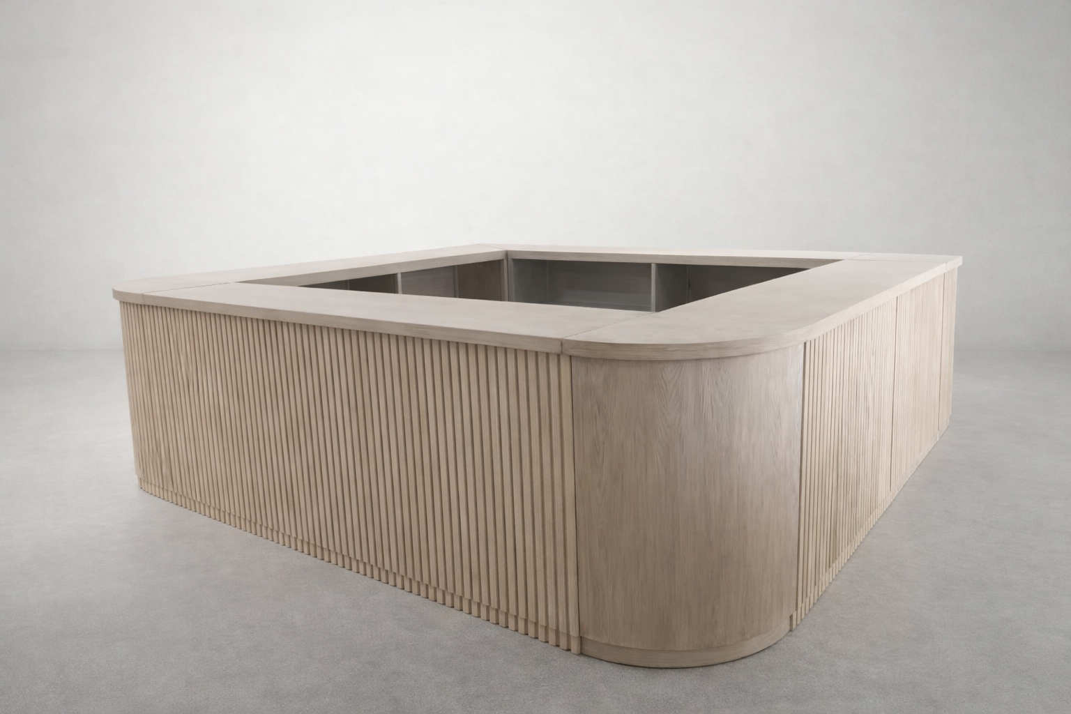 A custom bar with soft curves designed to feel intentional yet understated. Its clean, sculptural form creates an easy gathering point that supports conversation without overpowering the space.