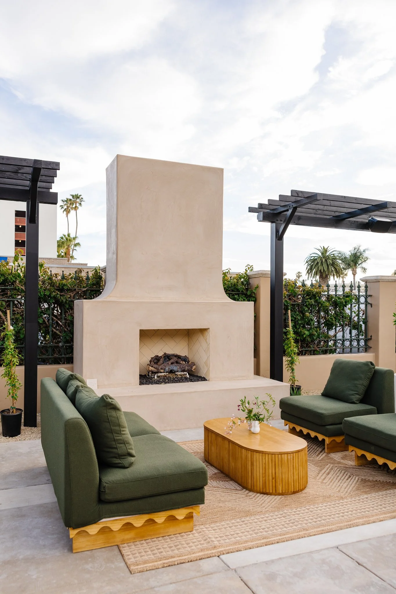 The outdoor fireplace anchors the patio as a natural gathering point. Built from simple, timeless materials, it brings warmth and structure to the space—equally suited for casual conversations or evening celebrations.
