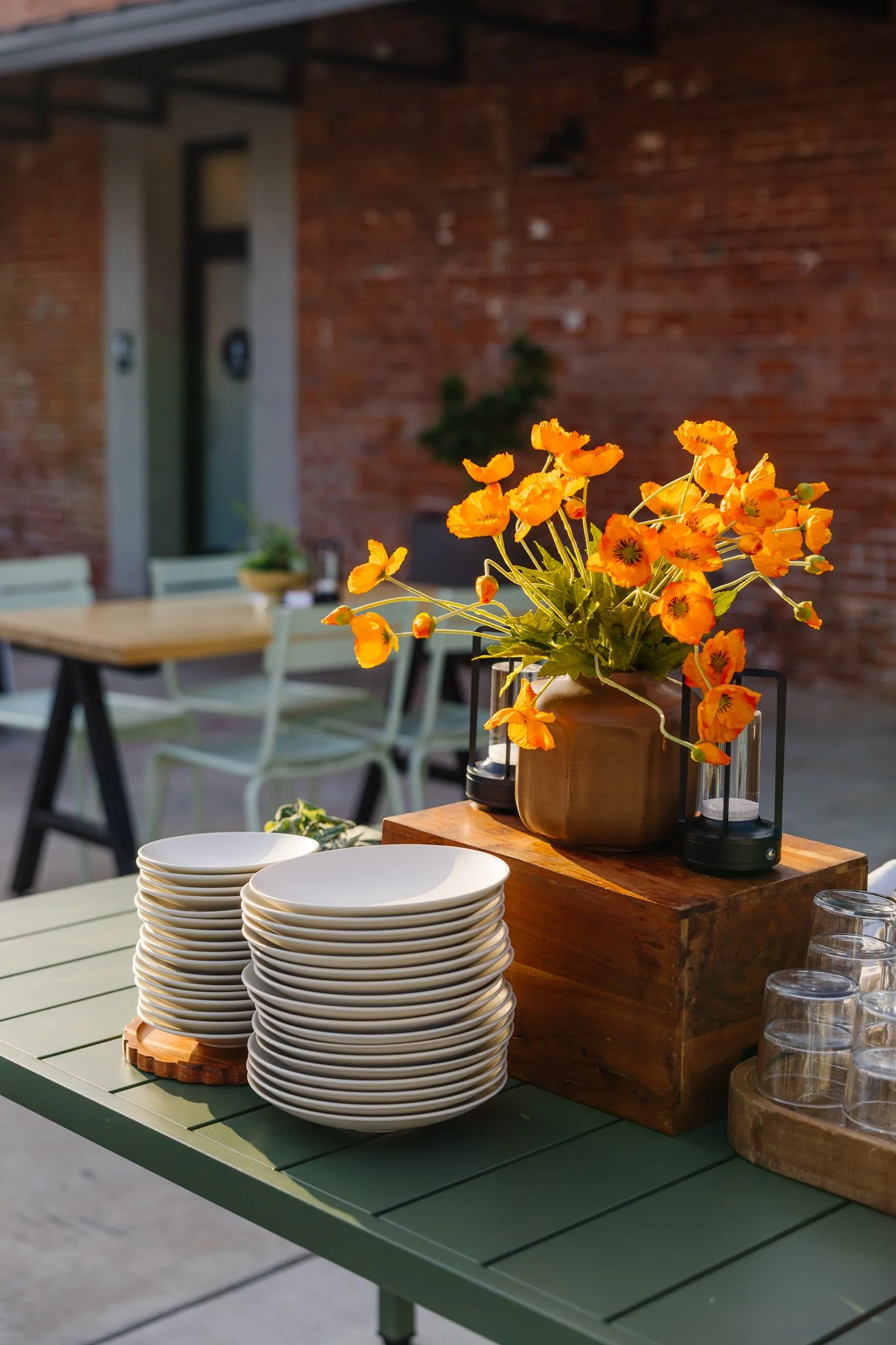 Floral arrangements and patio tables prepared for guests at The Patio at Palomino.
