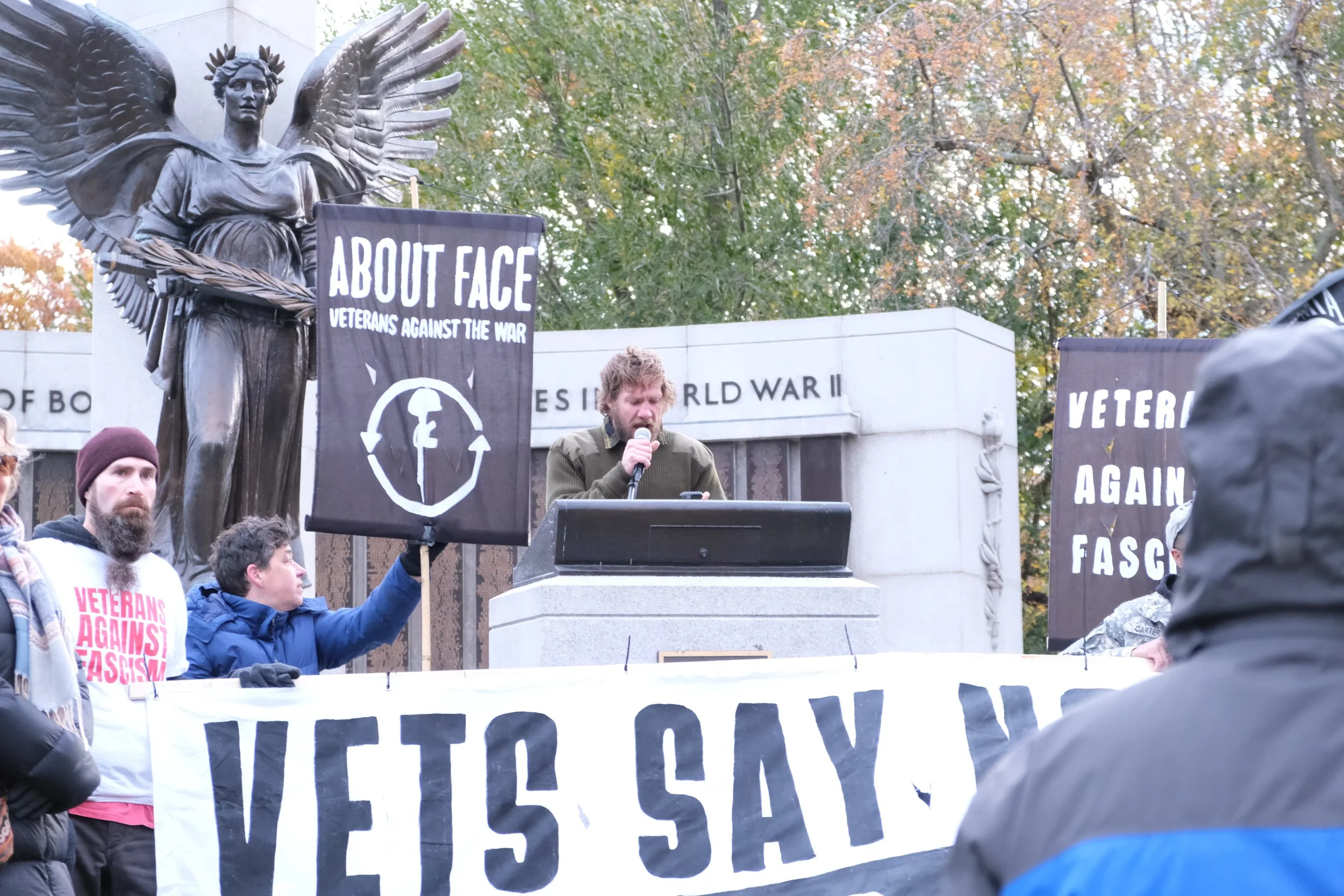 Organizer Brian Weckbacher speaks in front of crowd (BU Daily Free Press, Nov. 2025)