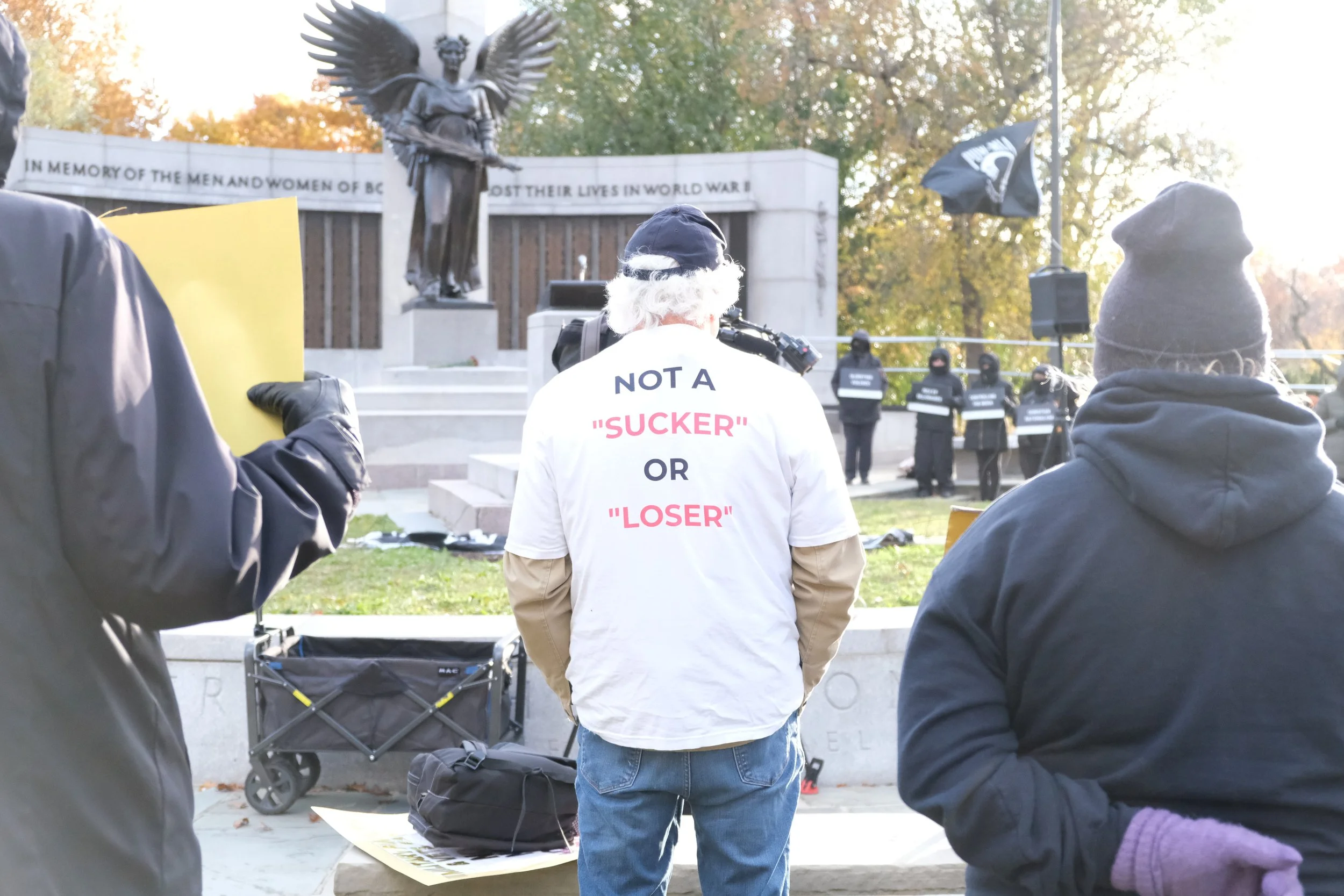 Protester wearing a shirt referring to President Trump's comments about veterans (BU Daily Free Press, Nov. 2025)