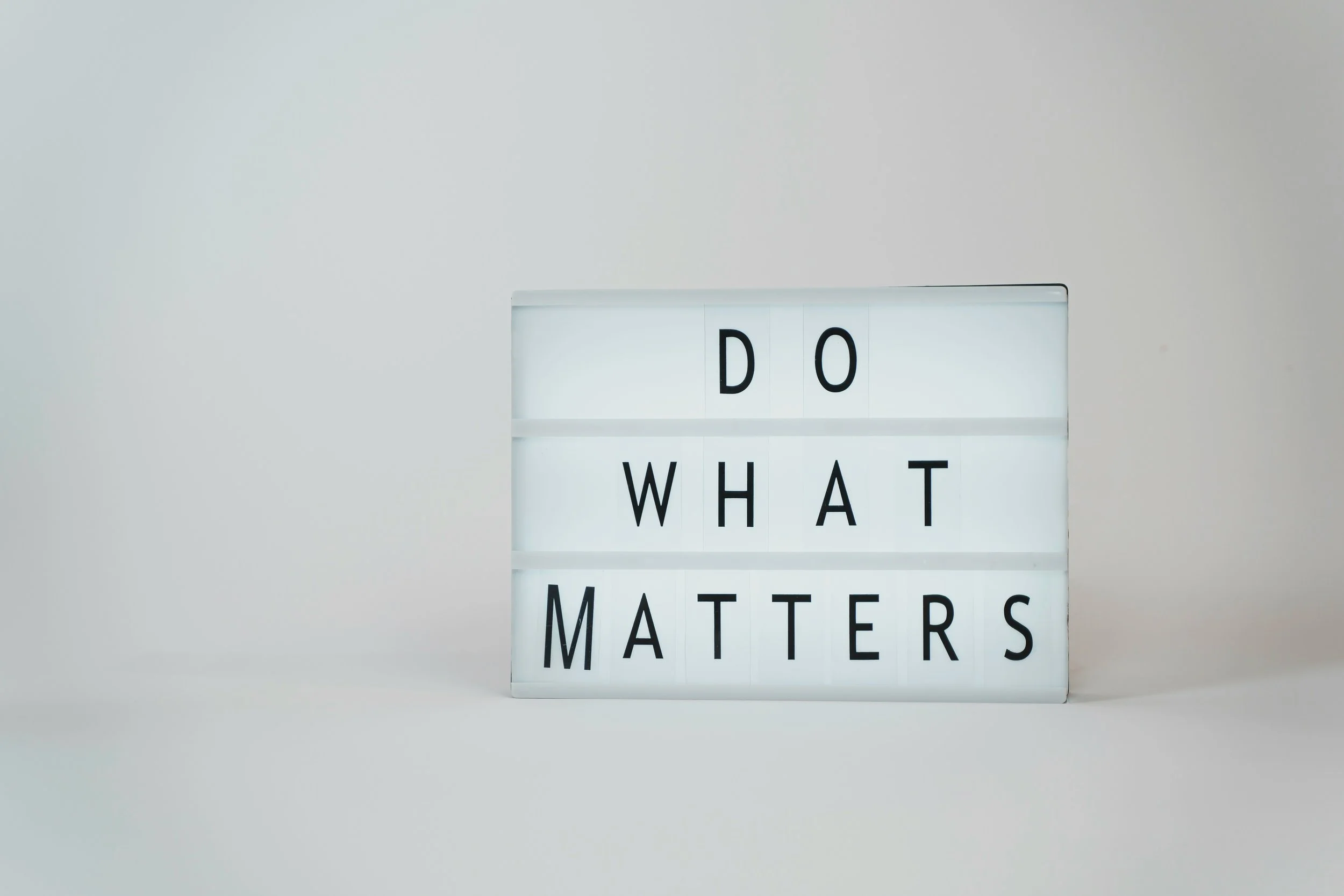 Lightbox display with the phrase 'Do What Matters' in black letters on a white background.