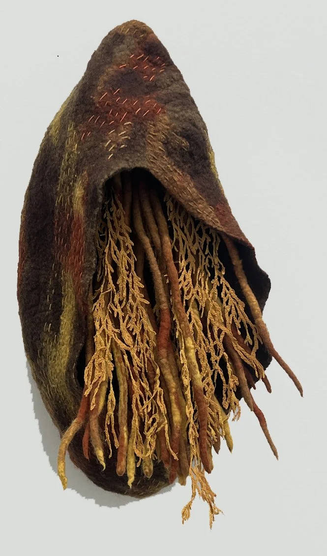 "Seed Pod 5" 2025, wool roving, embroidery thread (17 x 9 x 5")