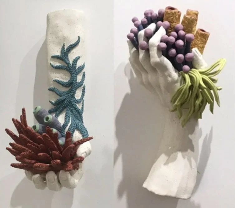 "In Your Hands 2" (13 x 6 x 5"); "In Your Hands 4" (12 x 6 x 5").  Both pieces: 2018, clay, mason stains, underglazes