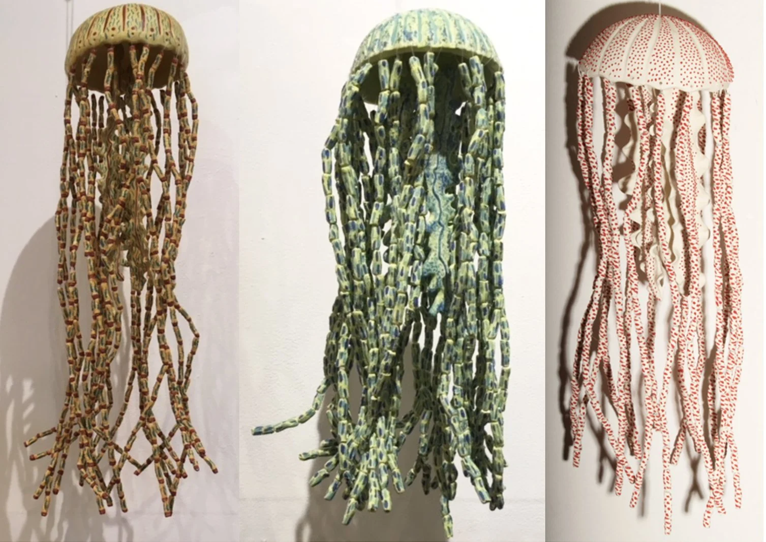 "Jellyfish 1" (23 x 8 x 8"); "Jellyfish 2" (17 x 8 x 8");  "Jellyfish 4" (18 x 8 x 8"). All pieces: 2020, clay, underglazes