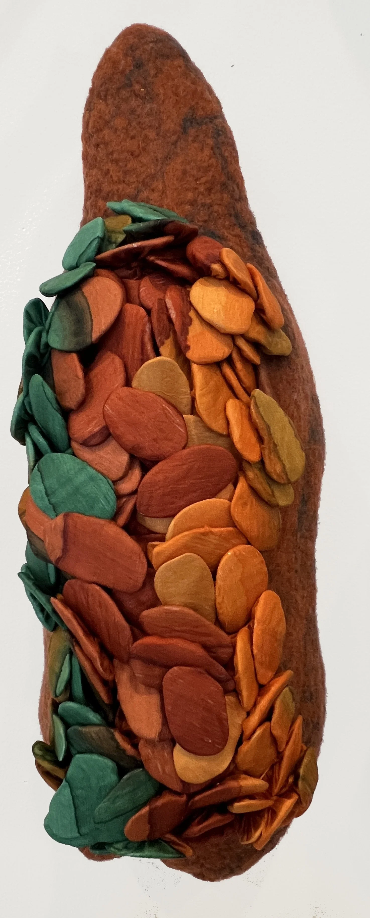 "Seed Pod 4"  2025, wool roving, silk, thread, clay (18 x  6  x  6")