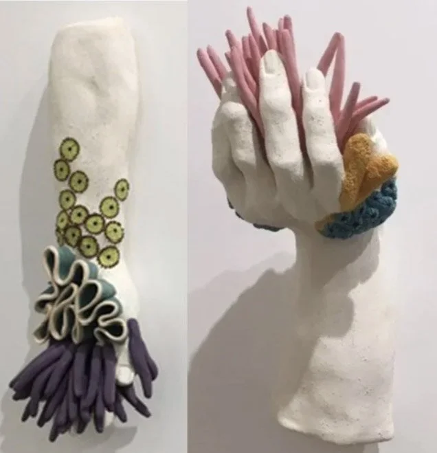 "In Your Hands 1" (12 x 5 x 2"); "In Your Hands 3" (10 x 4 x  6”). Both pieces: 2018, clay, mason stains, underglazes