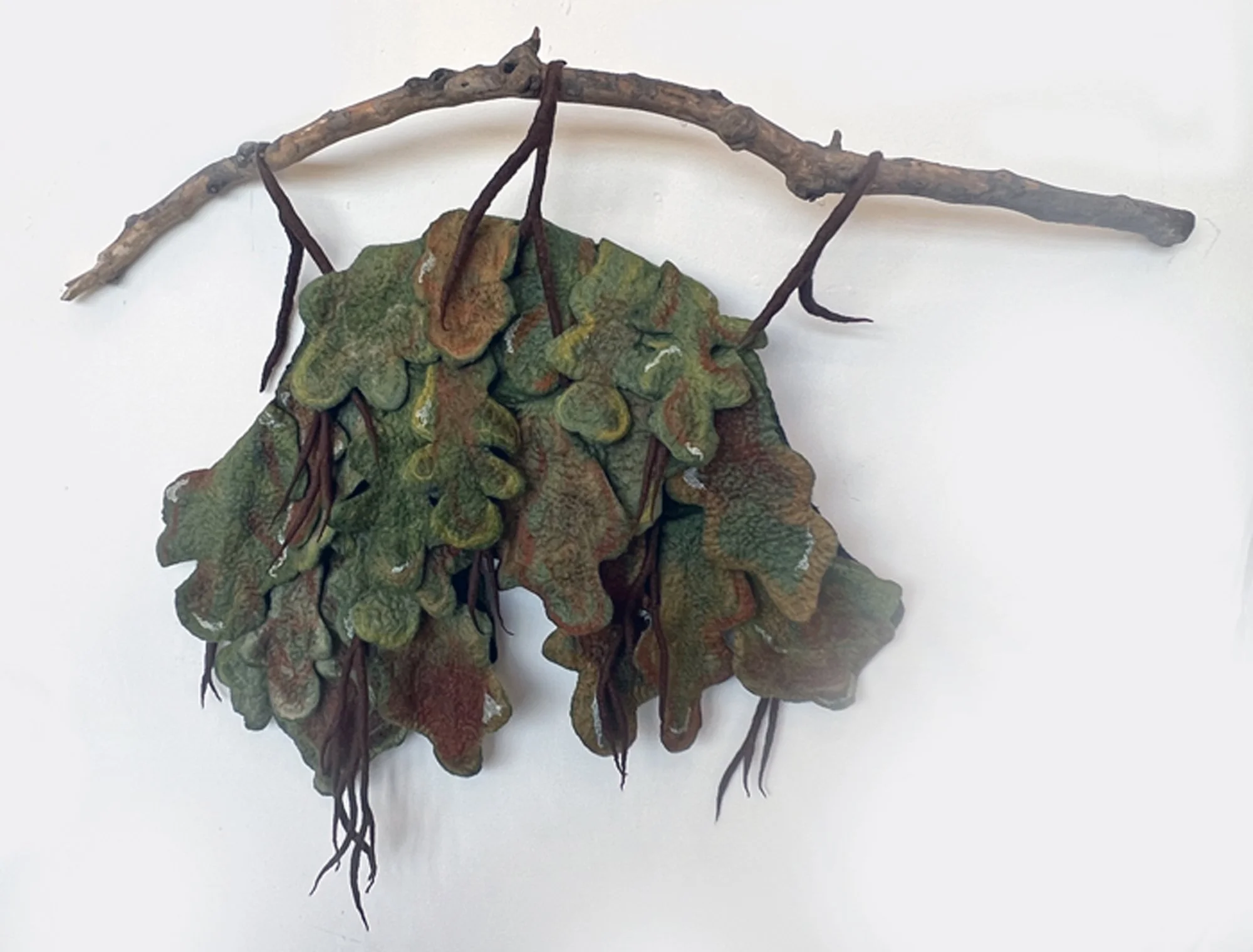 "Vestige of the Great Oak" 2025, wool roving, silk, tree branch (33 x 40 x 6") 