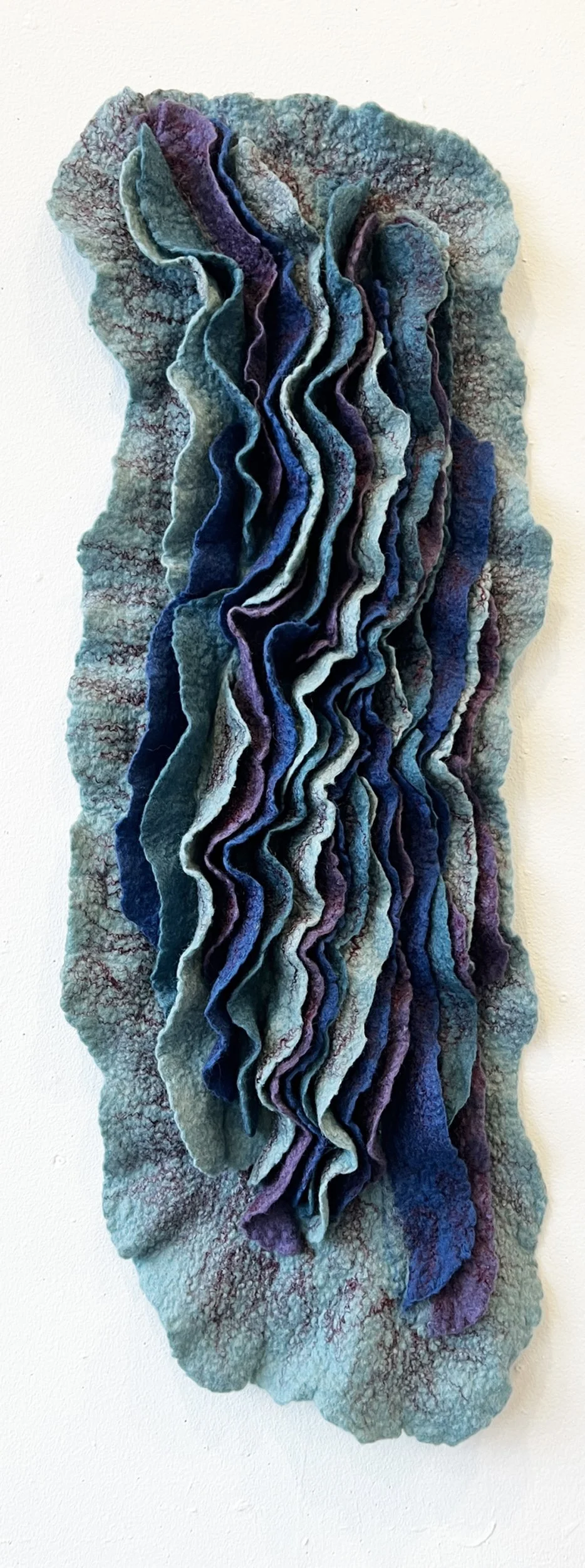 "Currents" 2025, wool roving (33 x 12 x 3")