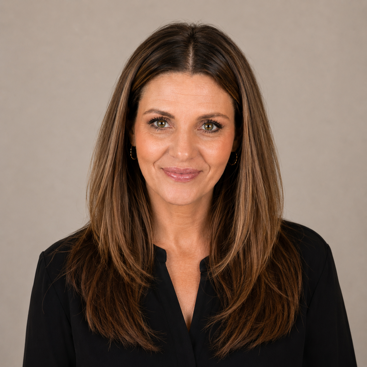 ProfessionPortrait of Joe-Ann Watkins, Registered Psychotherapist  and founder of Watkins Counselling & Wellness, smiling warmly against a soft neutral studio background.