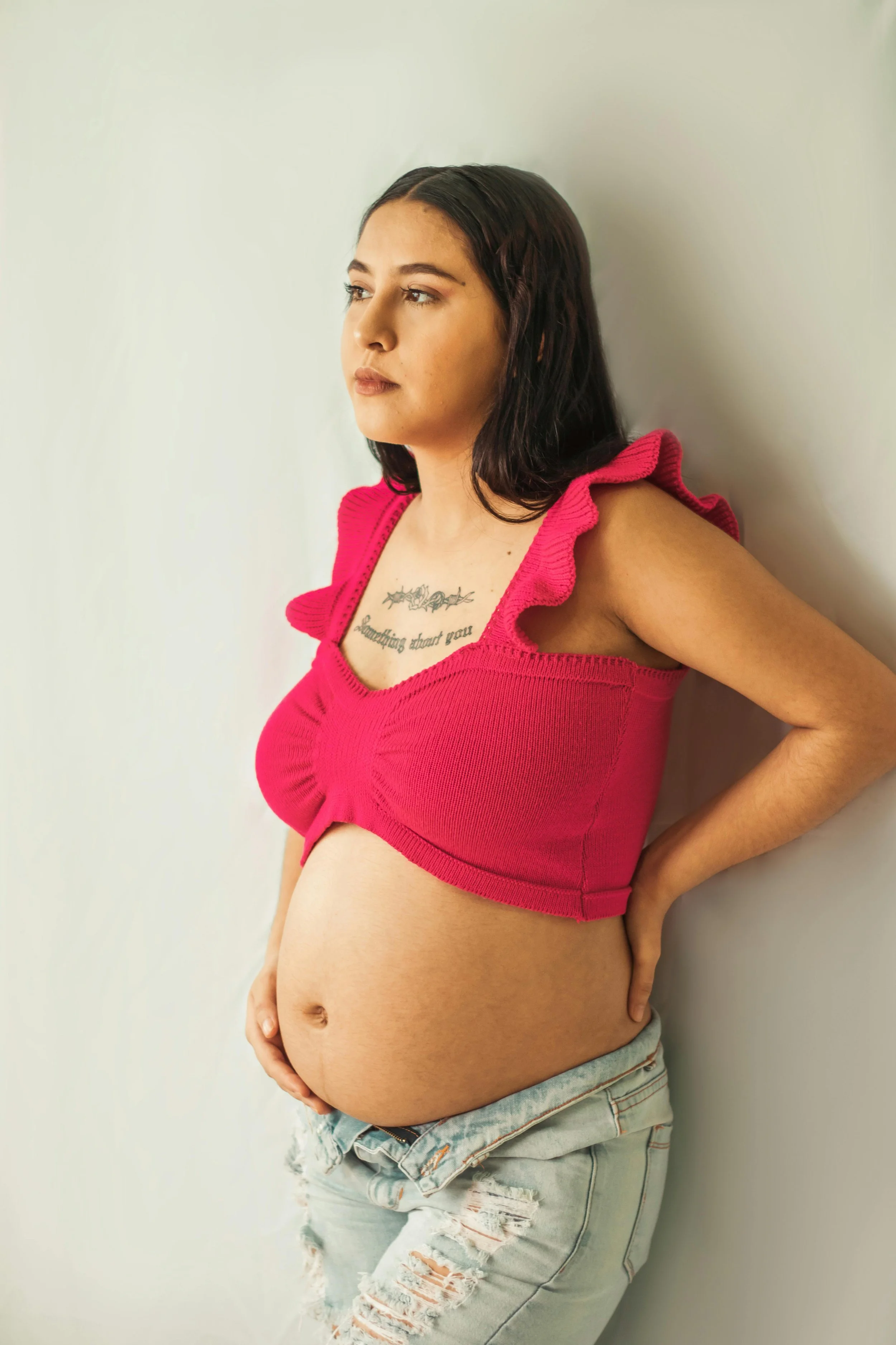 Pregnant individual reflecting during pregnancy and perinatal mental health support