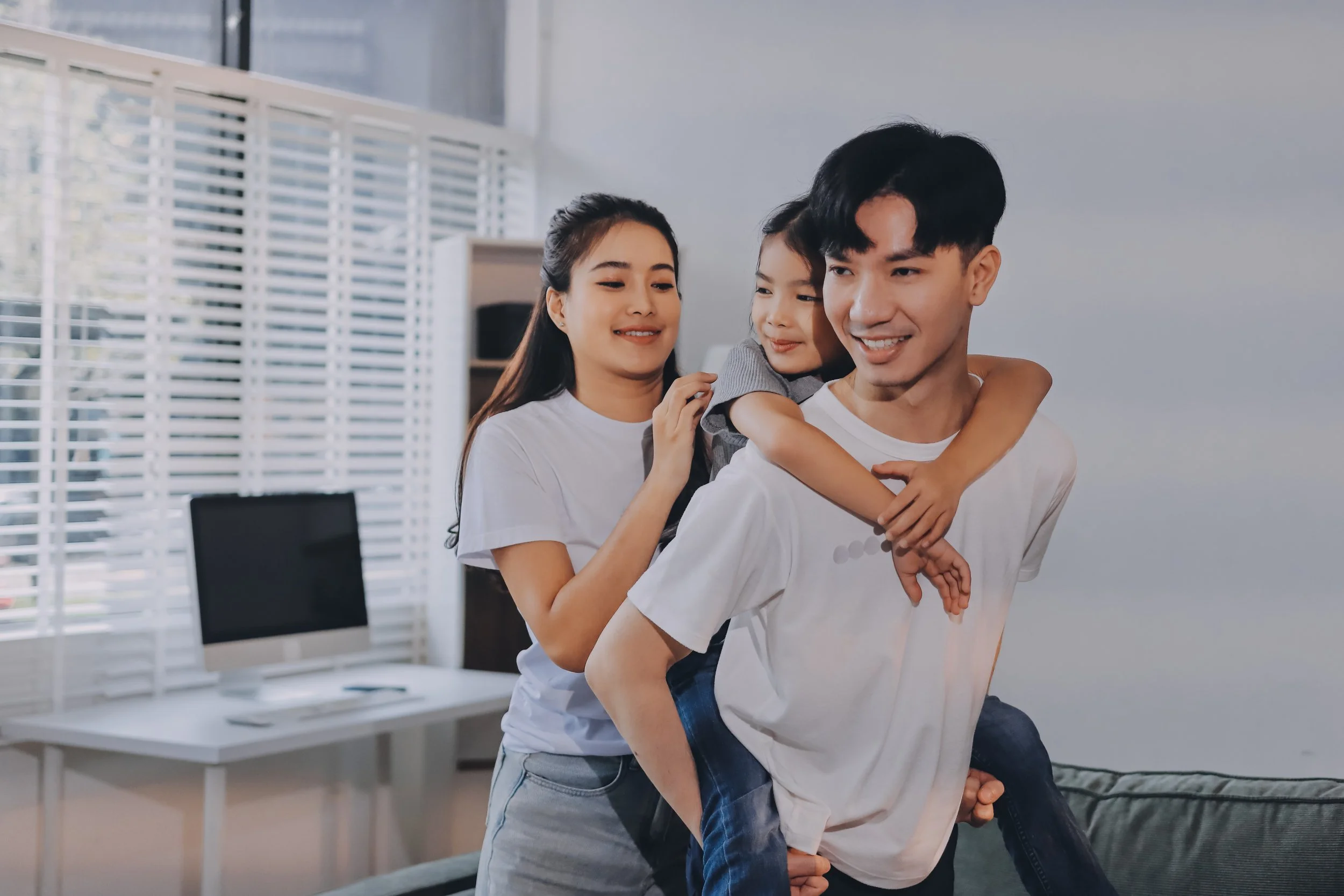 parents and child sharing a playful moment together, symbolizing secure attachment and family therapy support in smiths falls, ontario