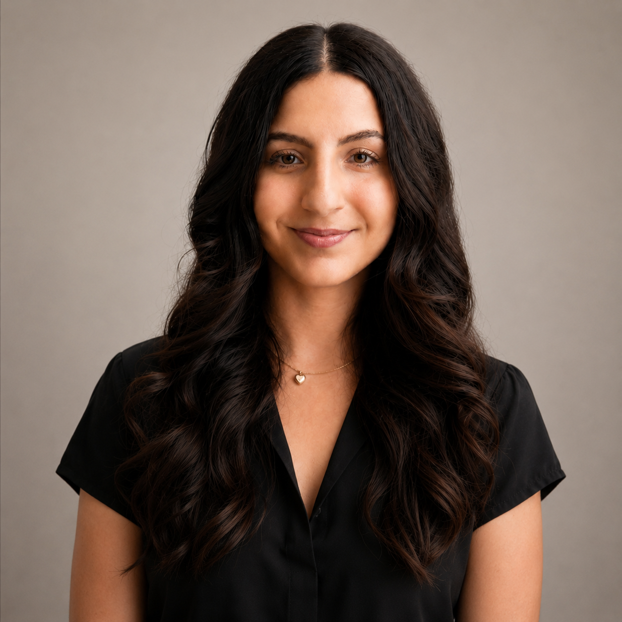 portrait of Yas Farokhnejad, Registered Psychotherapist (Qualifying) at Watkins Counselling & Wellness, with soft lighting and a calm neutral studio background.