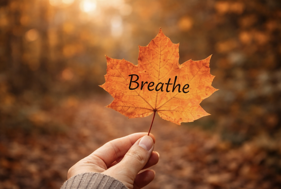 A calming October image featuring an autumn leaf with the word ‘breathe,’ representing emotional awareness, mindfulness, and grounding in a therapy blog by Watkins Counselling & Wellness in Ontario.