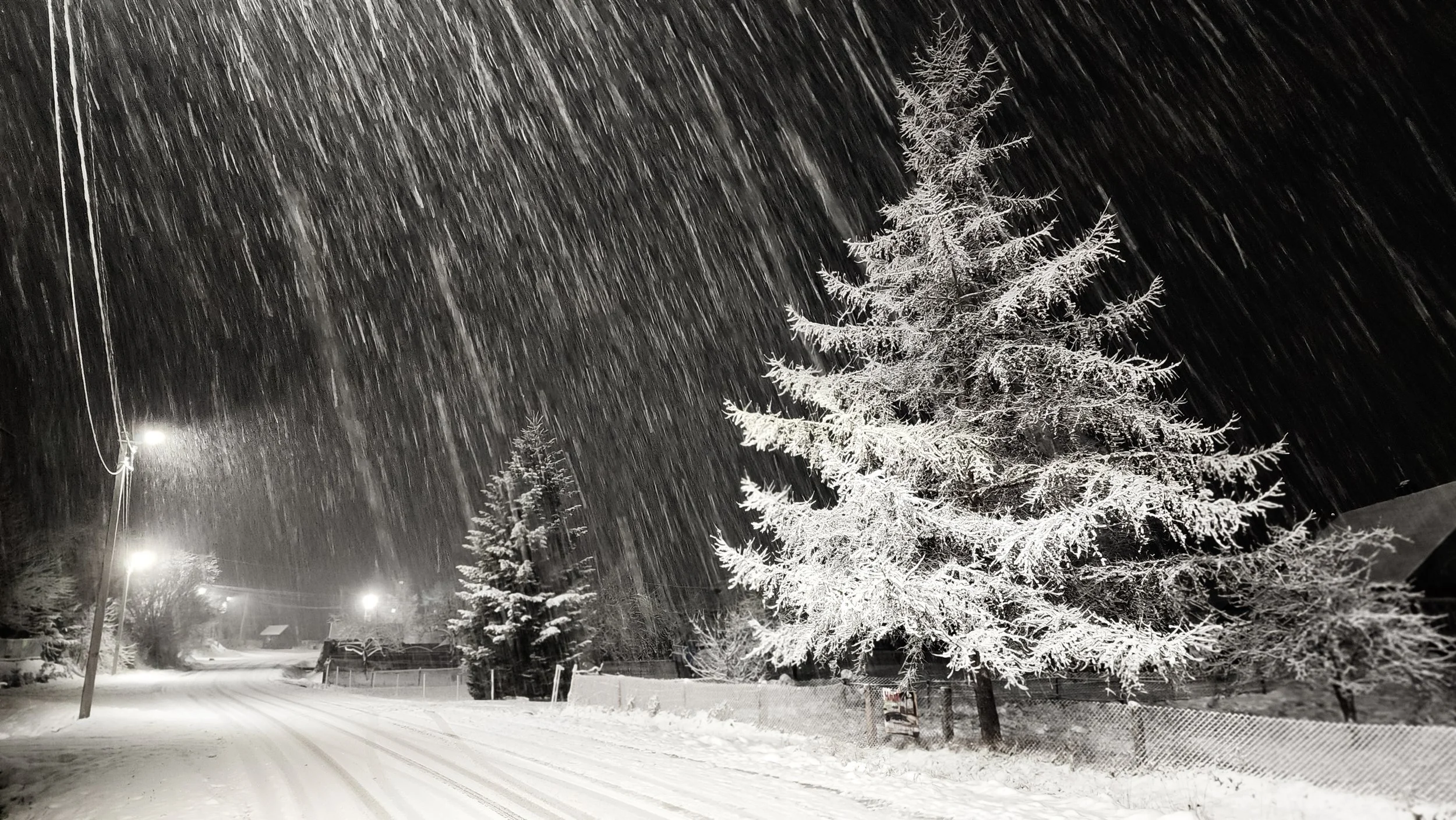 snow-covered rural road at night during a winter storm, symbolizing seasonal depression and emotional overwhelm, reflecting therapy support in smiths falls, ontario.