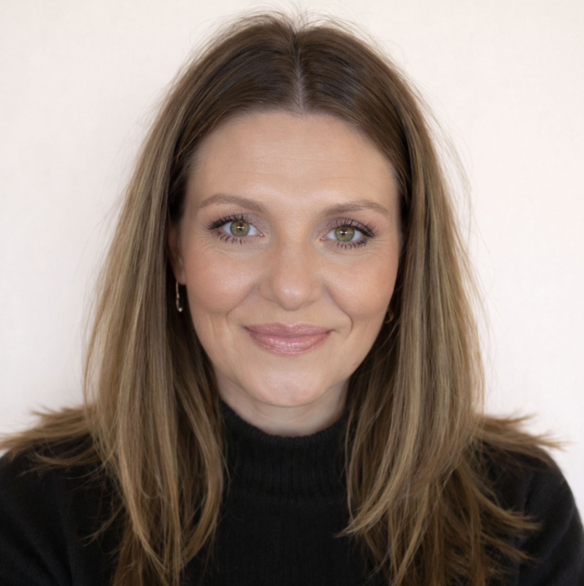 Joe-Ann Watkins, Registered Psychotherapist and founder of Watkins Counselling and Wellness, wearing a black turtleneck in a professional headshot.