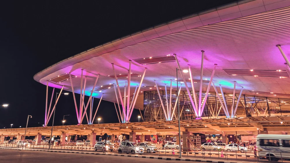 Illuminated airport terminal at night