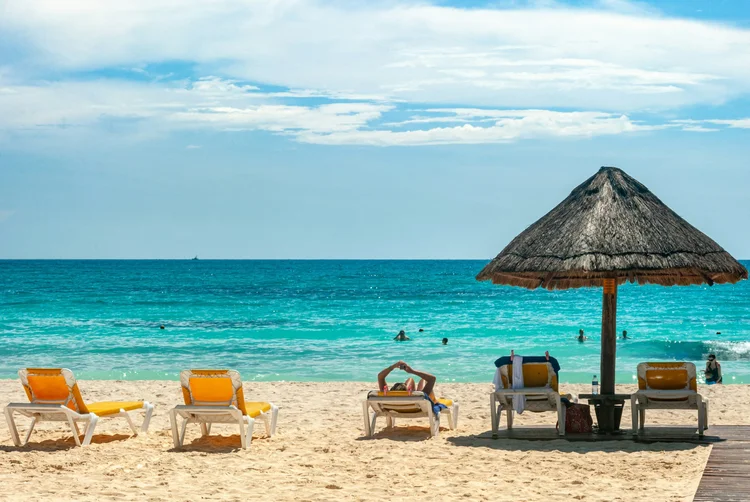 Beach loungers looking out to the sea