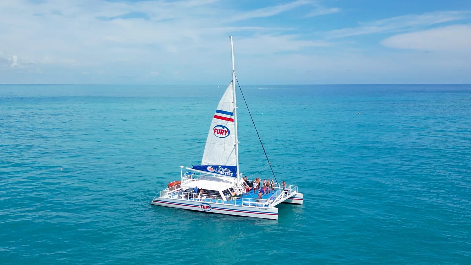 Fury sailing catamaran on turquoise water