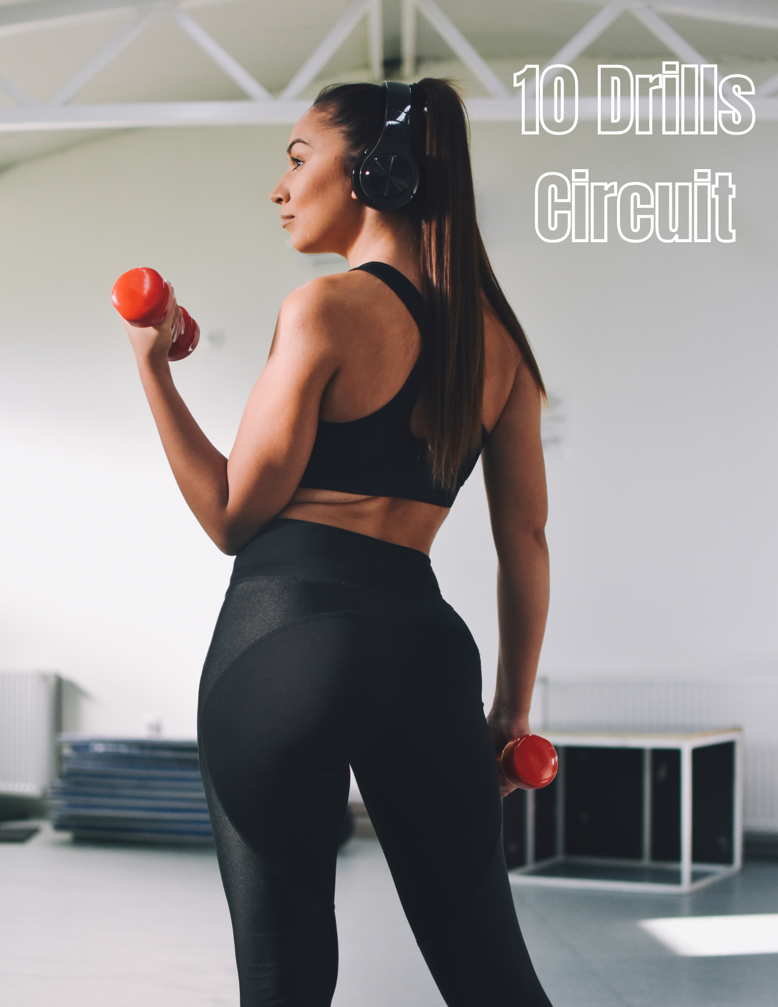 A woman in workout attire lifting a red dumbbell in a gym with white walls and exercise equipment in the background.