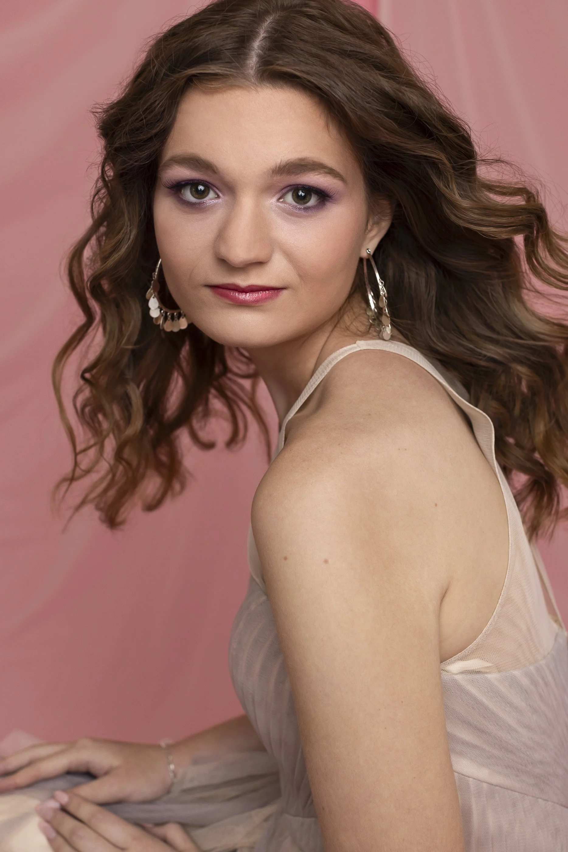 Studio Portrait of Girl with pink background