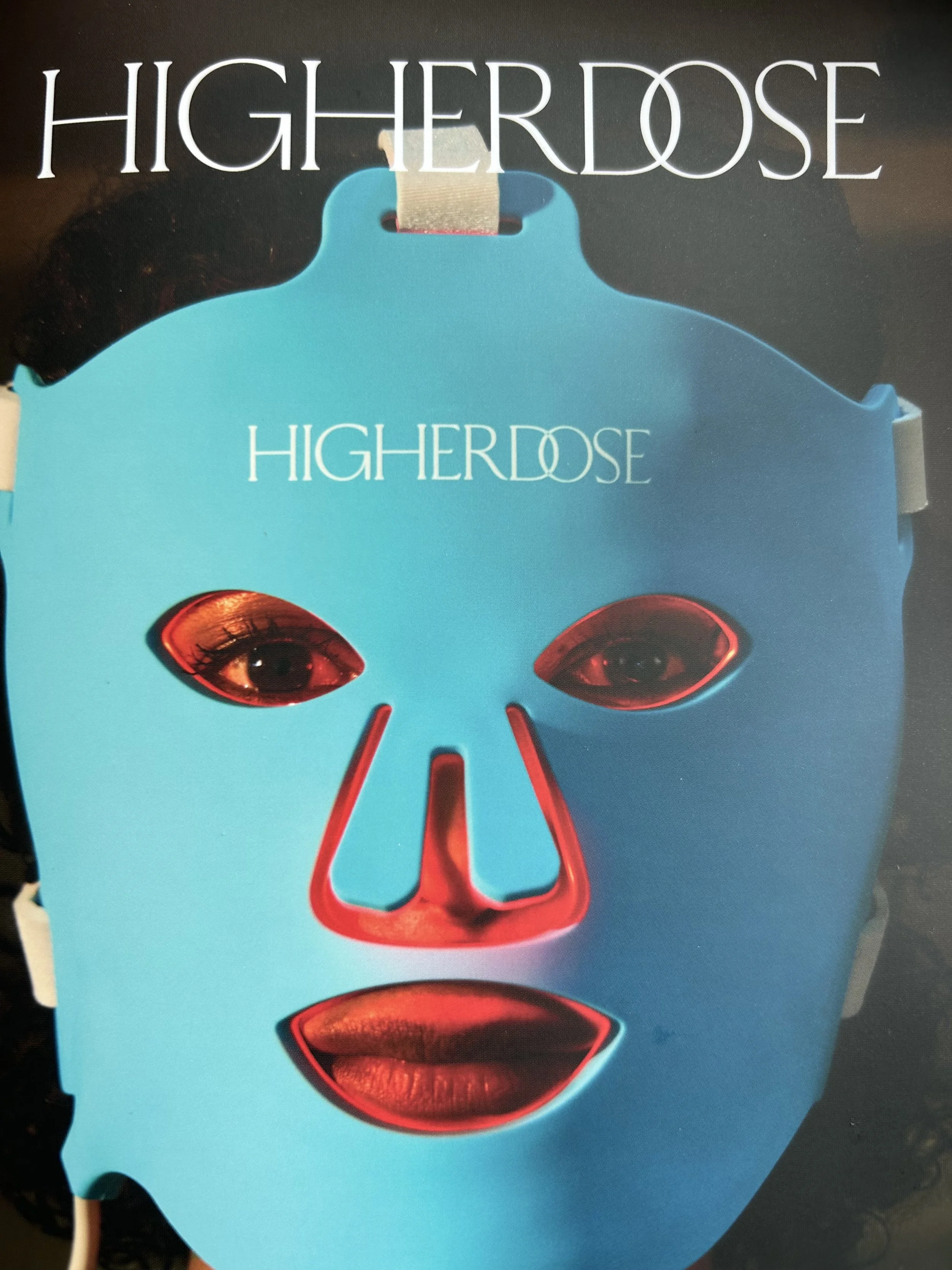 Blue Michael Myers mask with eye holes showing eyes and red-highlighted facial features, with the text 'HIGHERDOSE' at the top and in the middle.