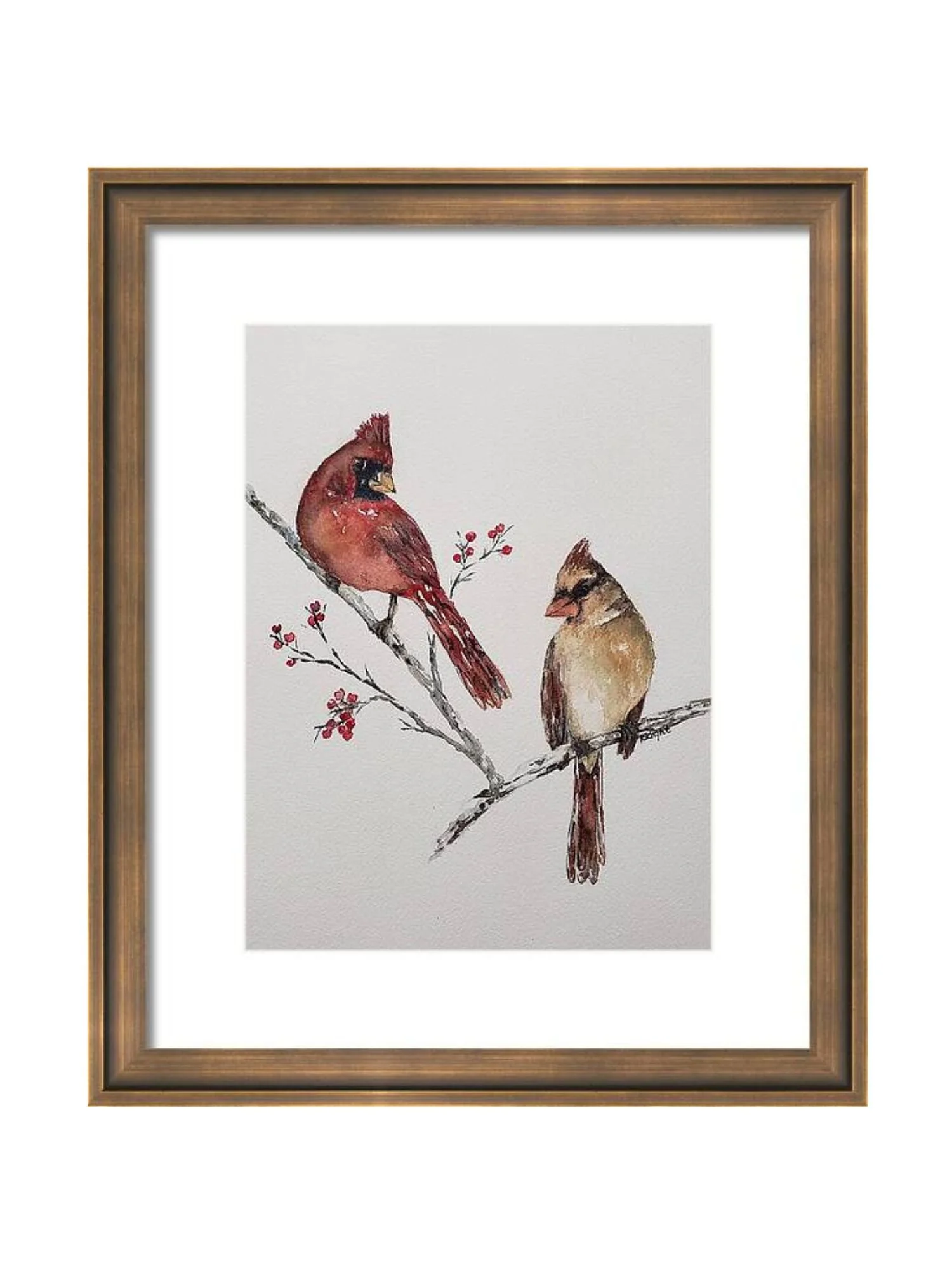 Watercolor painting of two cardinals perched on a branch with red berries, framed in a wooden frame.