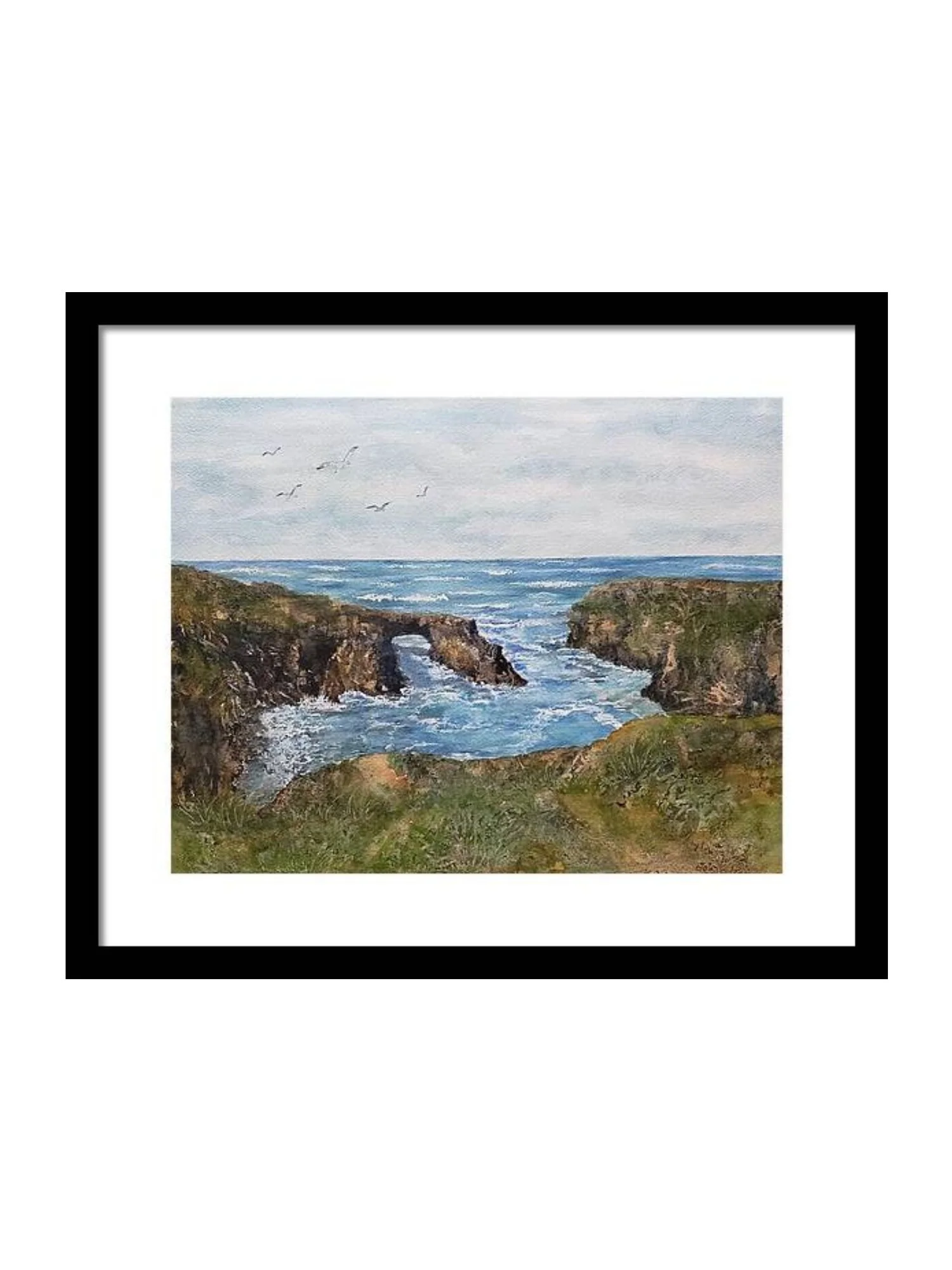 Watercolor painting of a coastal scene with rocky cliffs and arch, ocean waves, a cloudy sky, and birds flying overhead, framed in black, Mendocino Headlands.