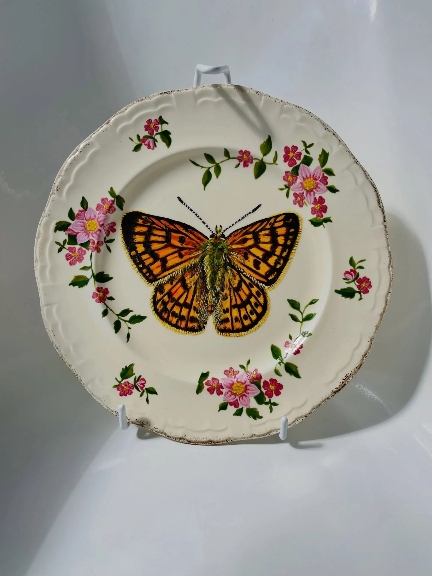 Rauparaha&rsquo;s Copper 

It was so enjoyable reclaiming the pattern around the rim of this plate! It took a bit longer than I anticipated, with three to four layers of paint. The butterfly took seven layers of paint, but now hopefully it has a long