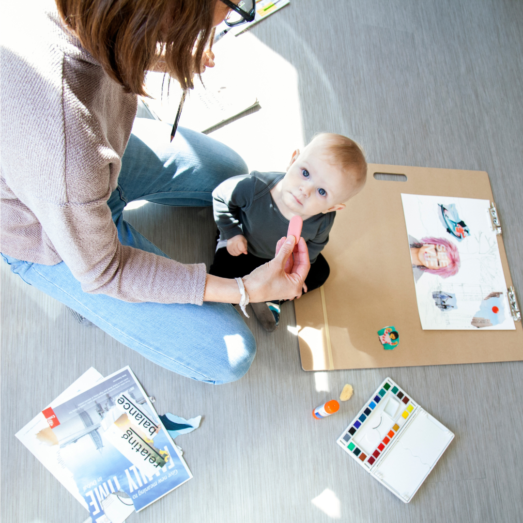 Mother making art with child