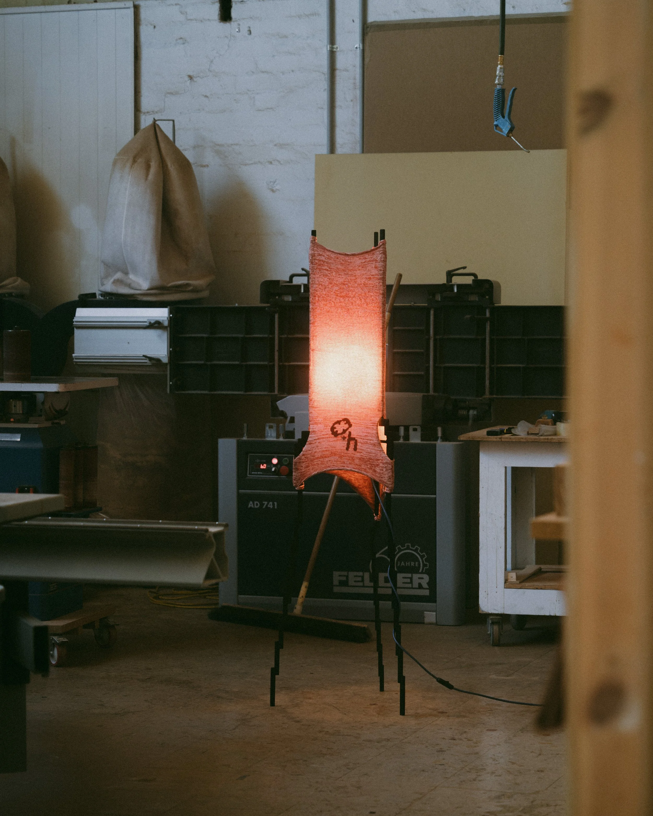 Glitch floor lamp with pixelated steel frame and stretched knit fabric, by Moraene and Tricote