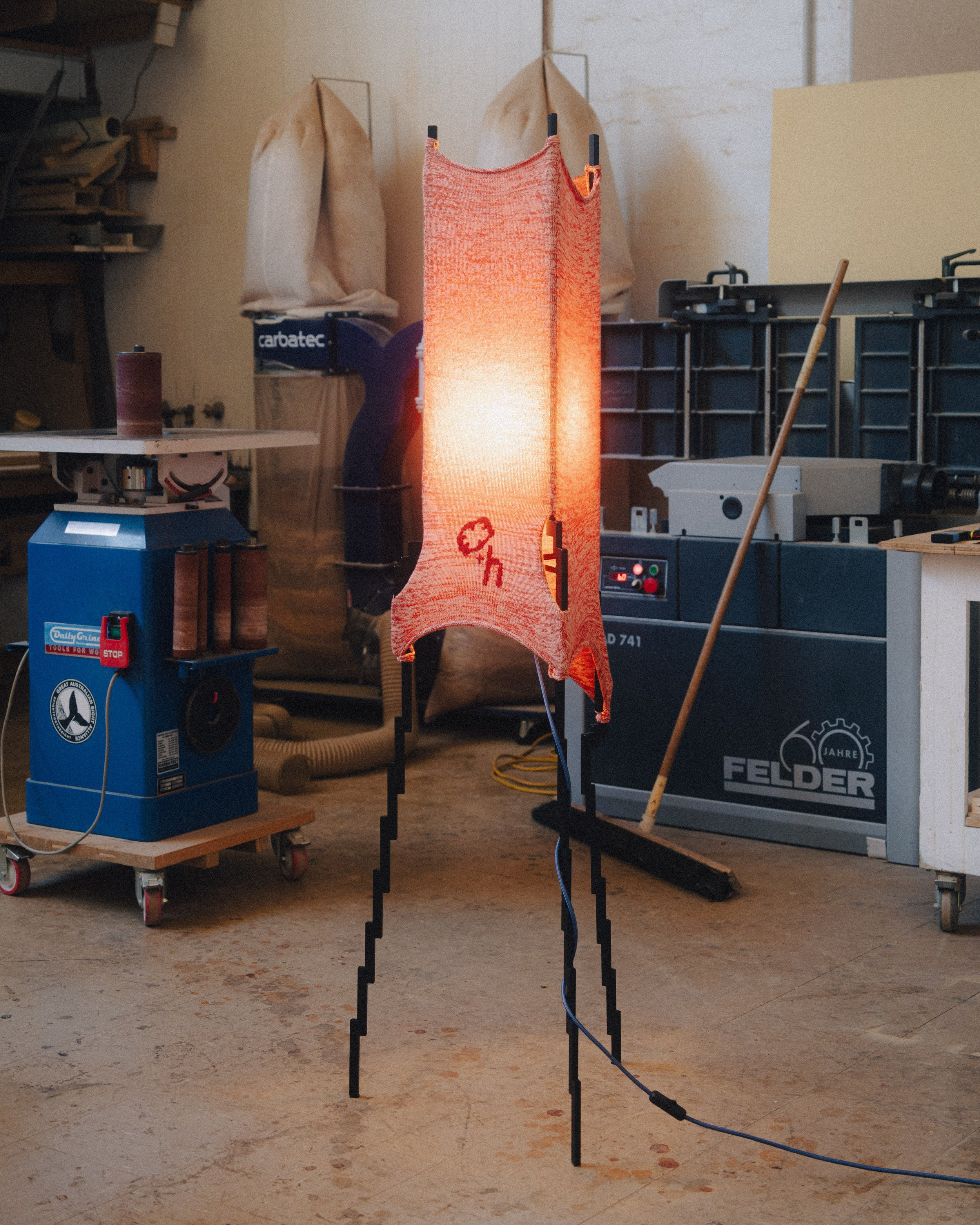 Glitch floor lamp with pixelated steel frame and stretched knit fabric, by Moraene and Tricote