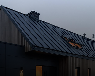 Modern kitchen with white cabinets, black hardware, stainless steel appliances, and light wood flooring, featuring a loft area with a wooden ladder.