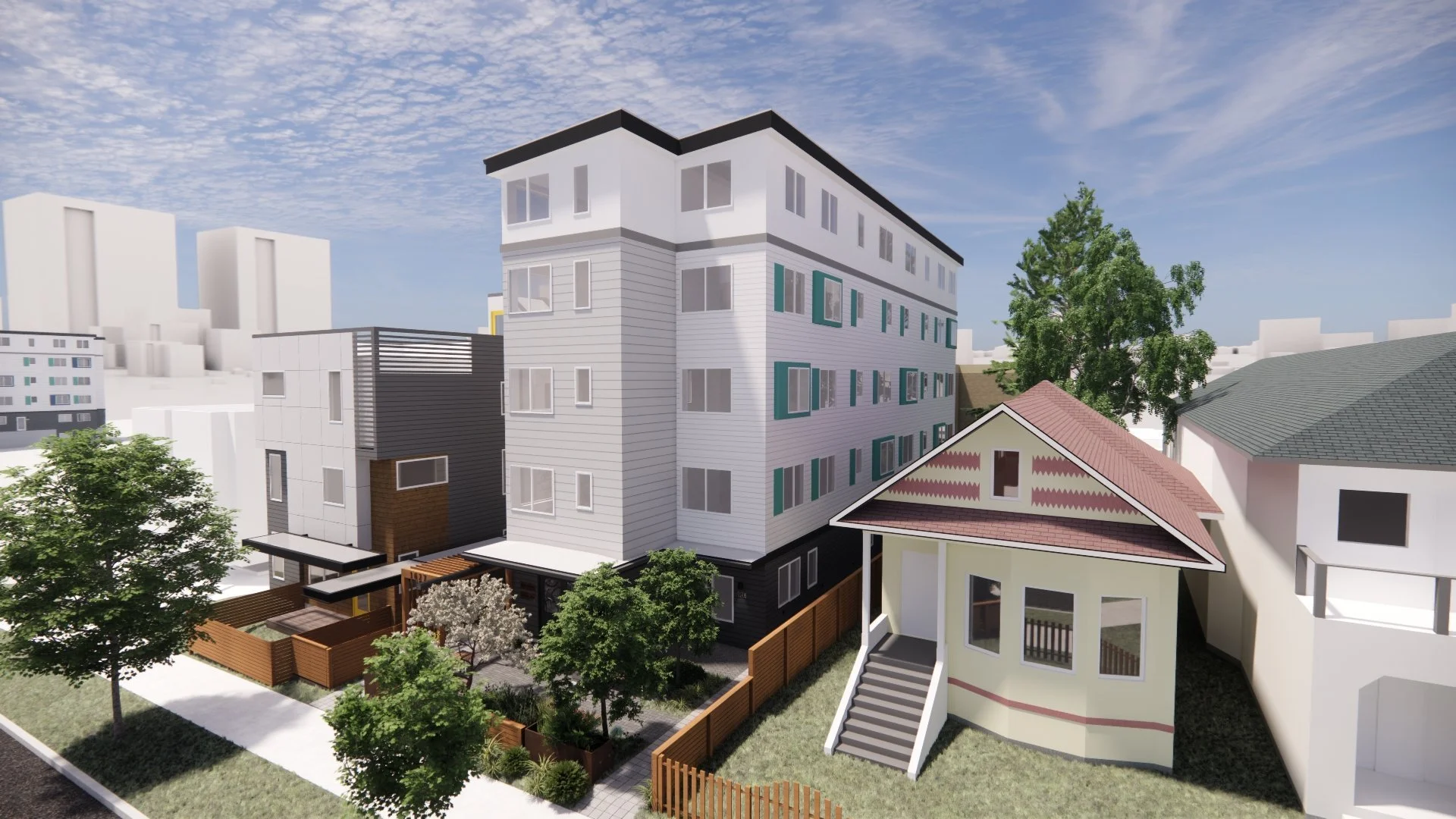 Modern kitchen with light wood cabinets, stainless steel appliances including a dishwasher, oven, and refrigerator, and a laundry area with a washing machine and dryer in the background. The room has wood-look flooring and white walls with small windows.