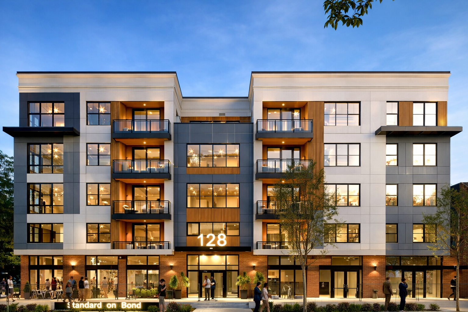 Front view of a modern two-story house painted dark gray with large windows, a garage, and a landscaped front yard with small bushes, flowers, rocks, and a concrete walkway.