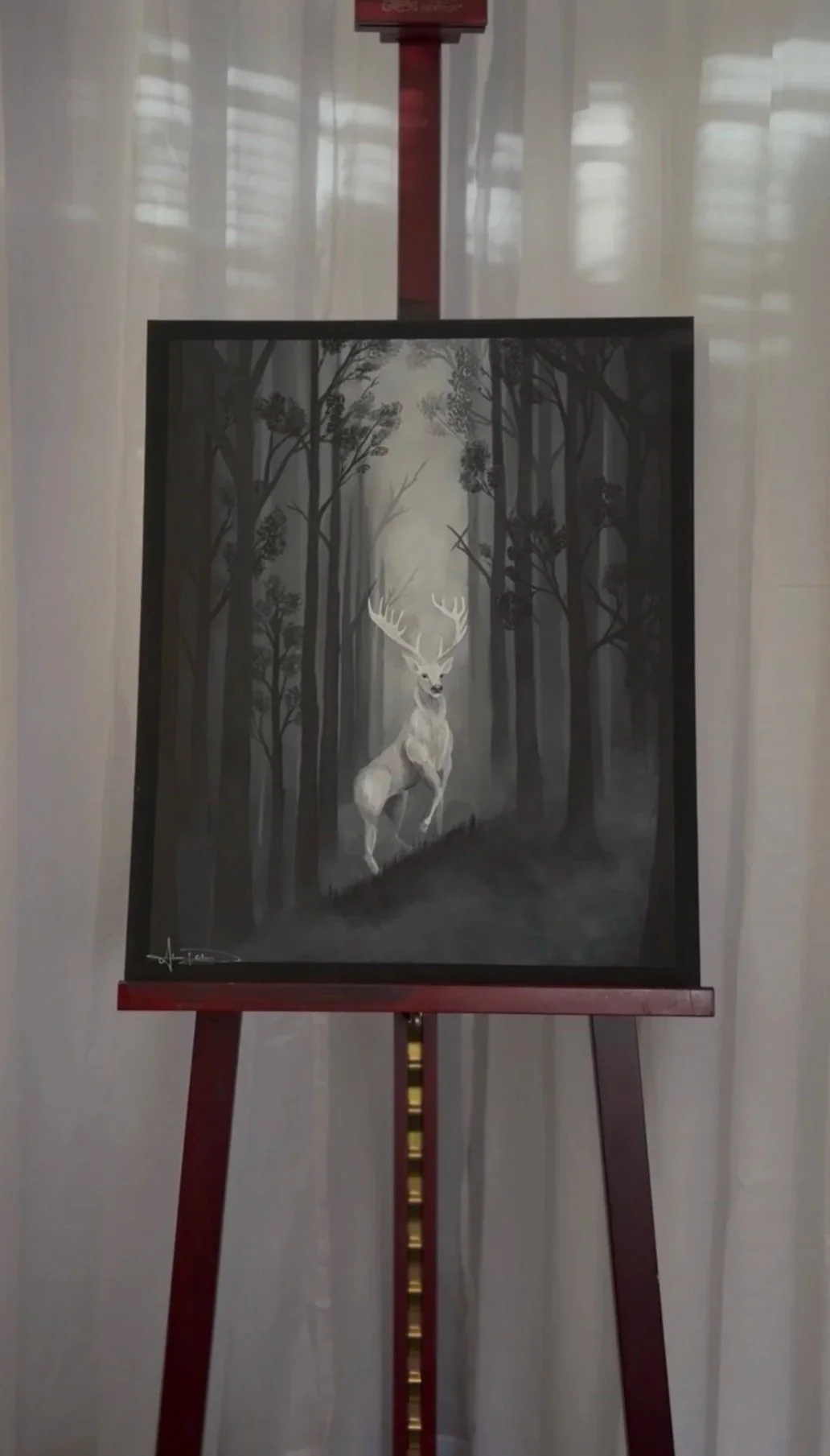 Mythical white stag in foggy forest