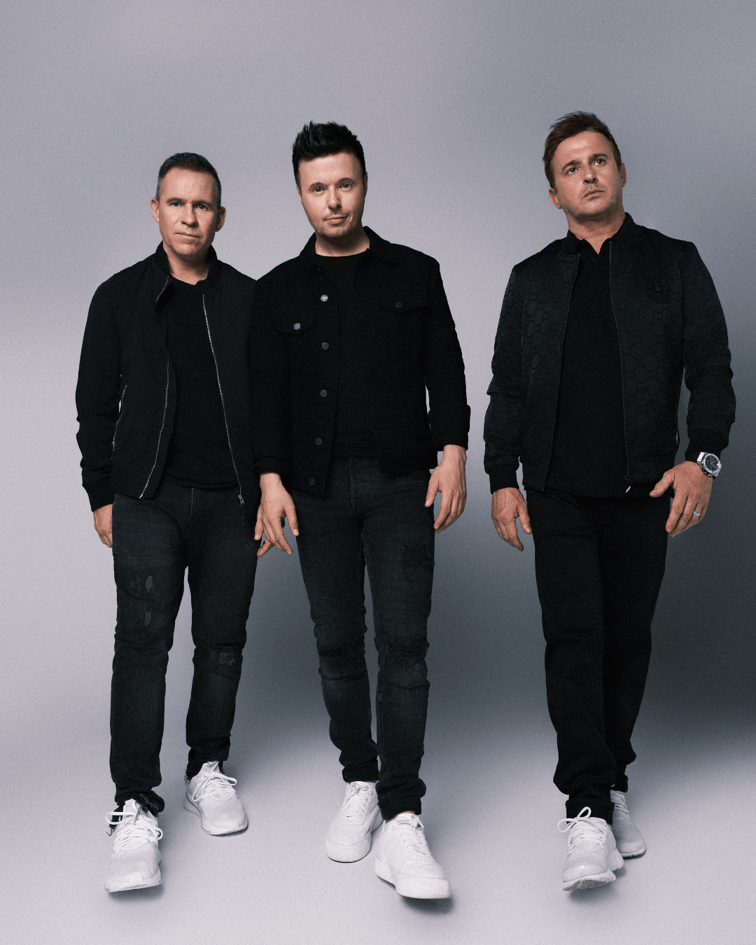 911 posing for a promotional shoot in 90s fashion, known for their UK chart hits and teen idol status.