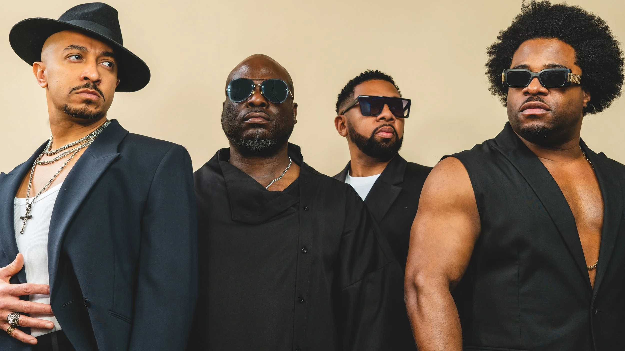 Damage boy band posing for a stylish promo shoot, popular 90s R&B group known for smooth vocals and hit singles, iconic UK pop act.