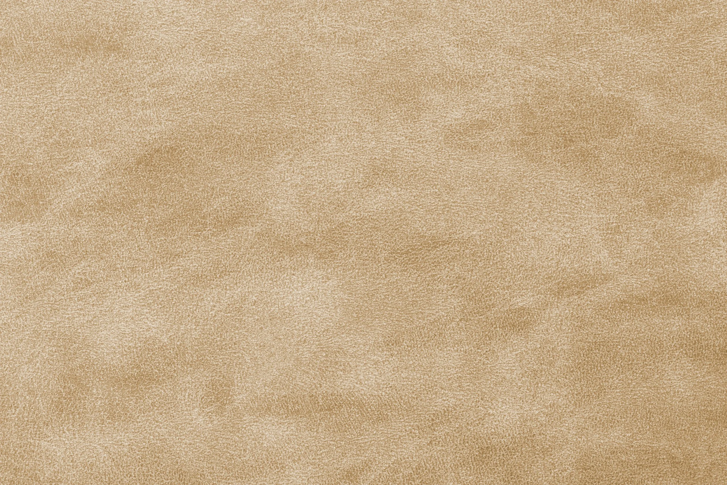 A close-up of beige-colored fabric with a soft, textured surface.