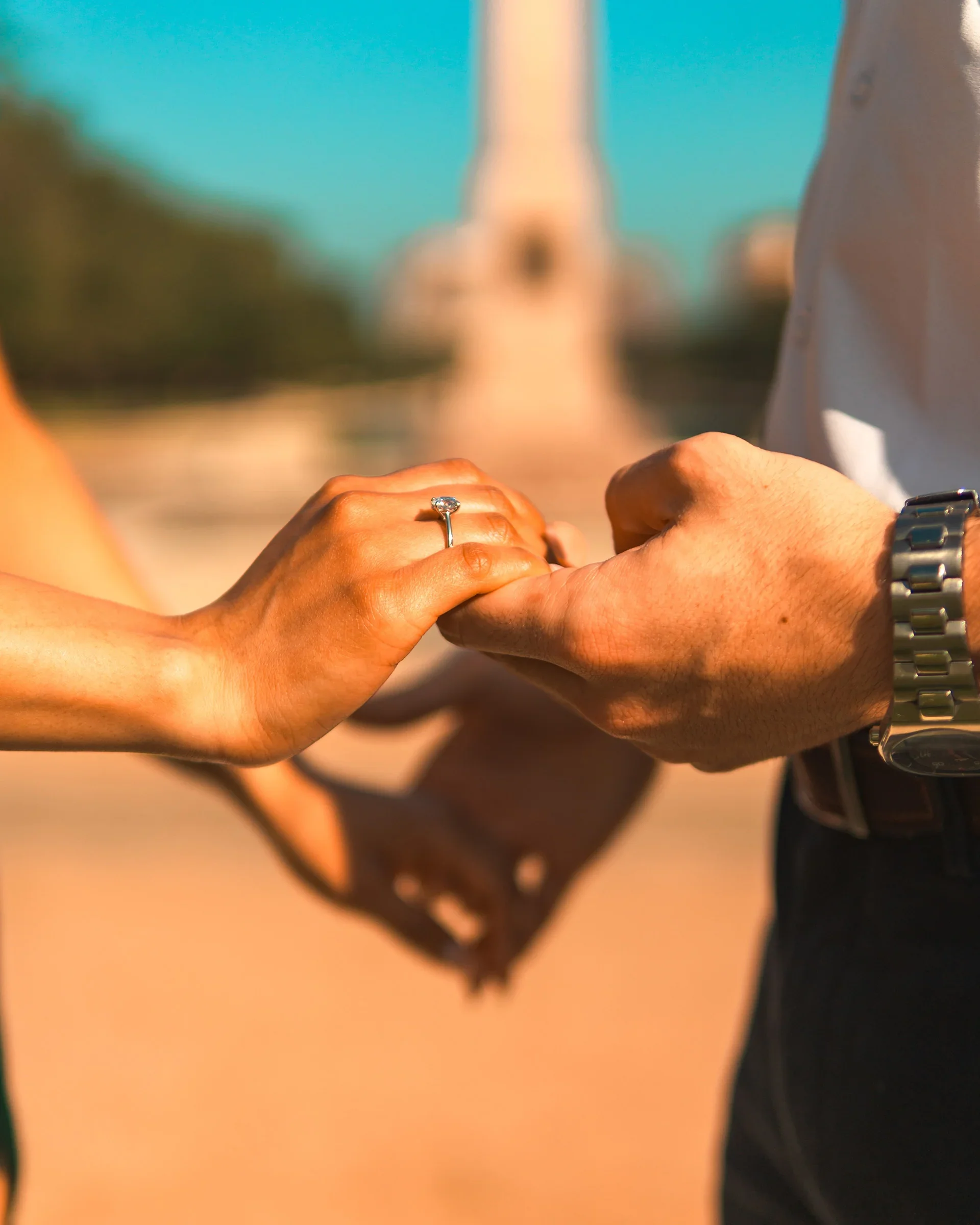 FOTOS By NOE engagement photography in Houston — couple holding hands and showcasing the new ring that the groom gave to his bride.