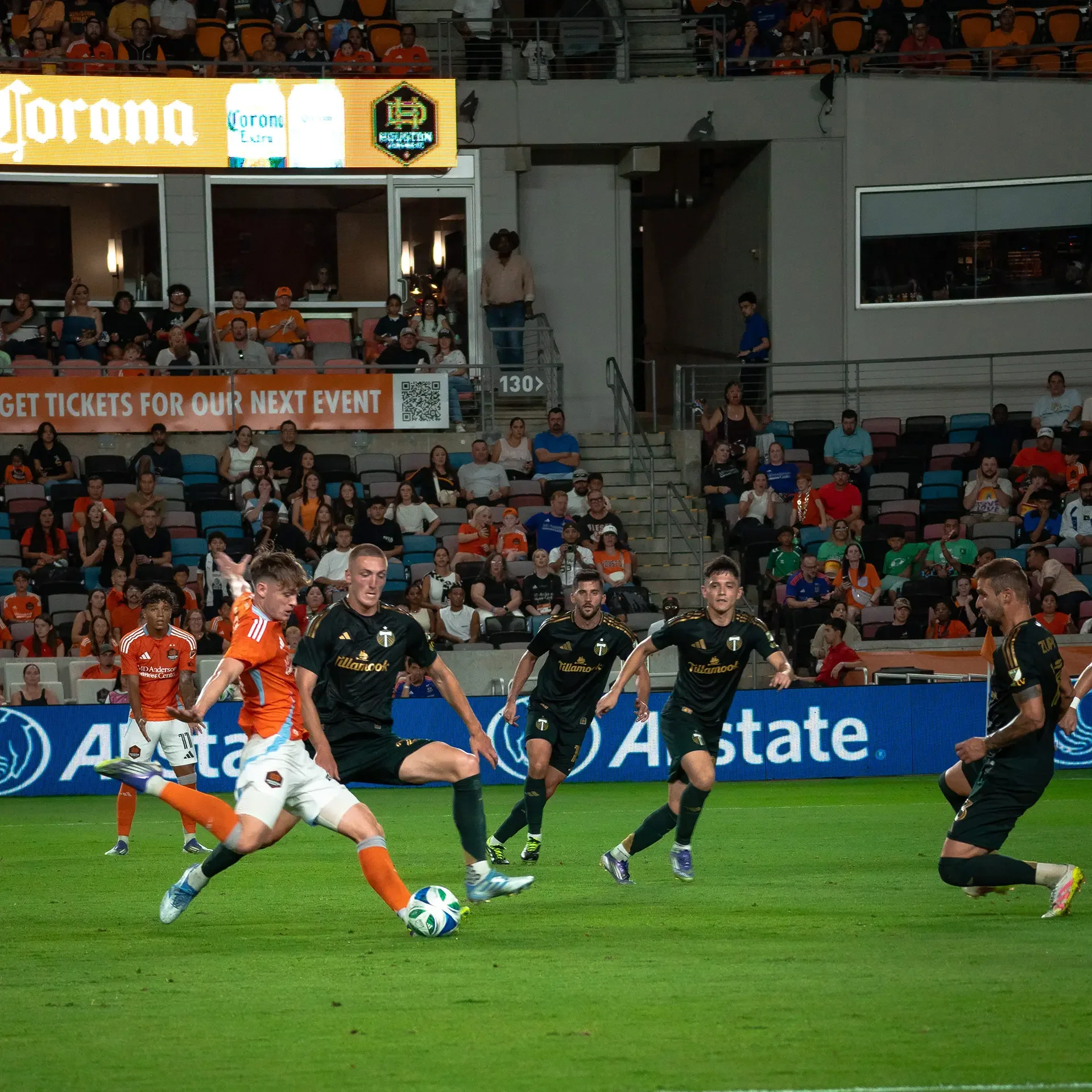 A fast pace moment in Sports Photography. A Houston Dynamo Player taking a show to the goal!