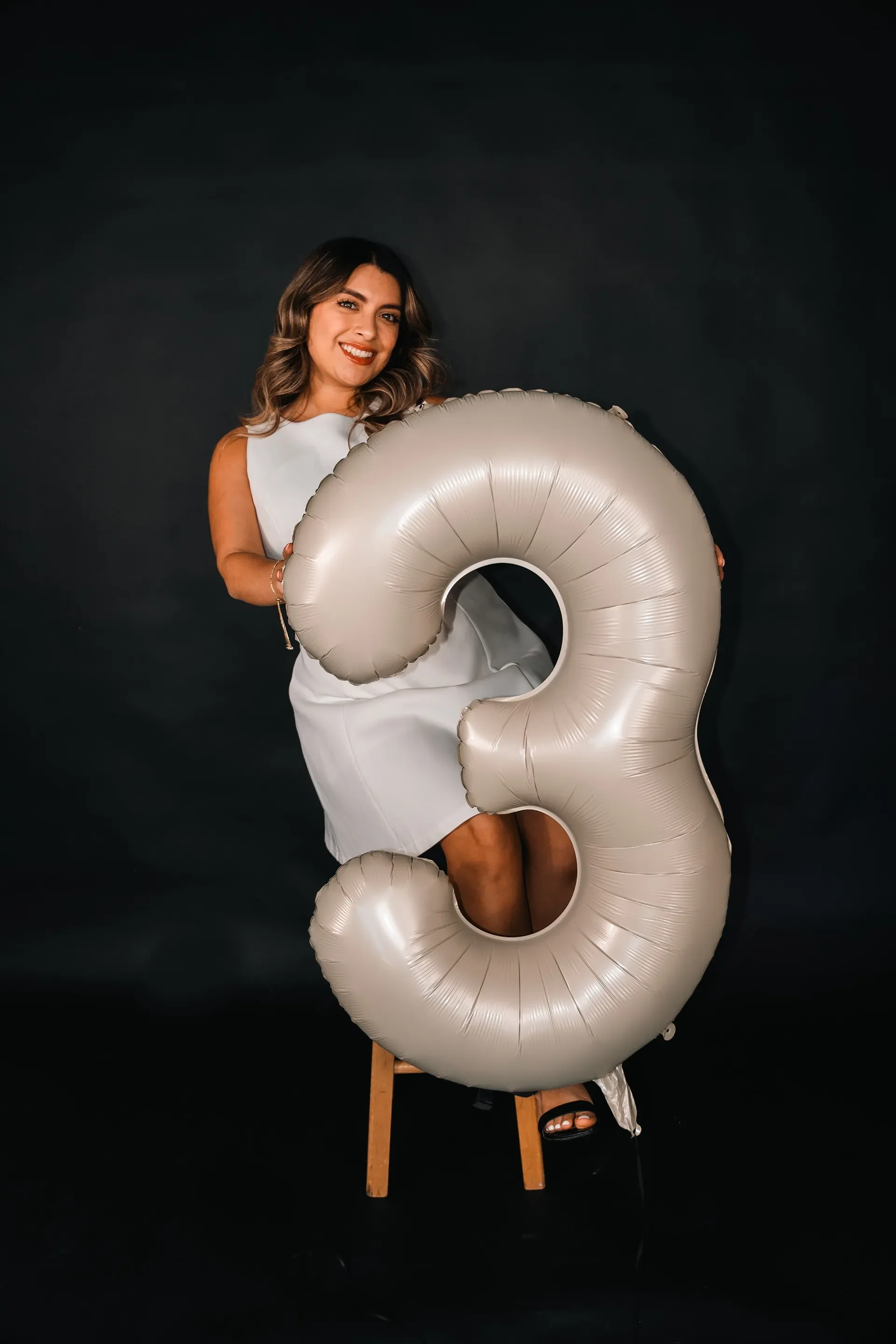 A girl getting her 30th birthday photoshoot done in a Houston Photography Studio.