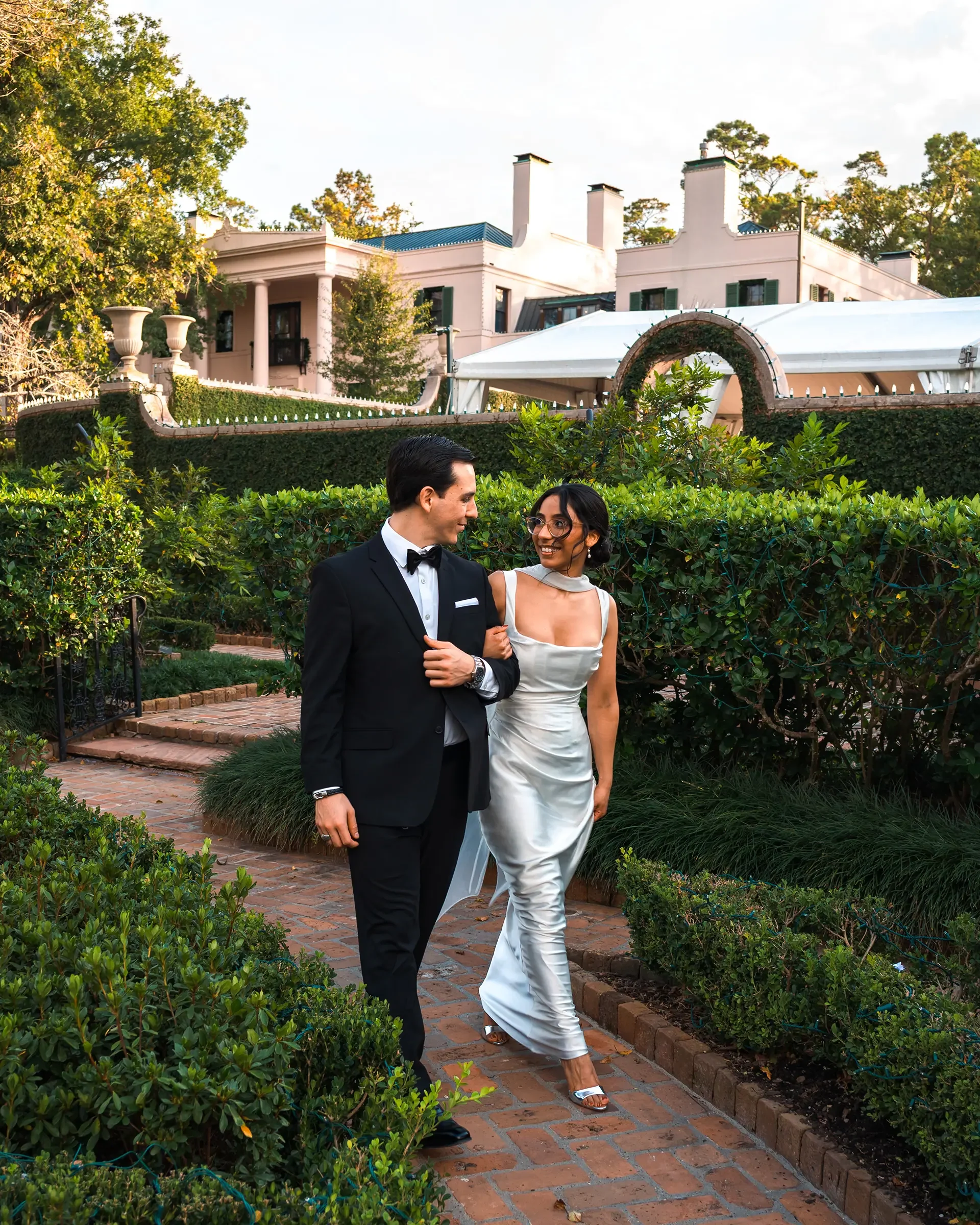 A newly engaged couple getting their engagement photoshoot in Houston at a garden near memorial park.