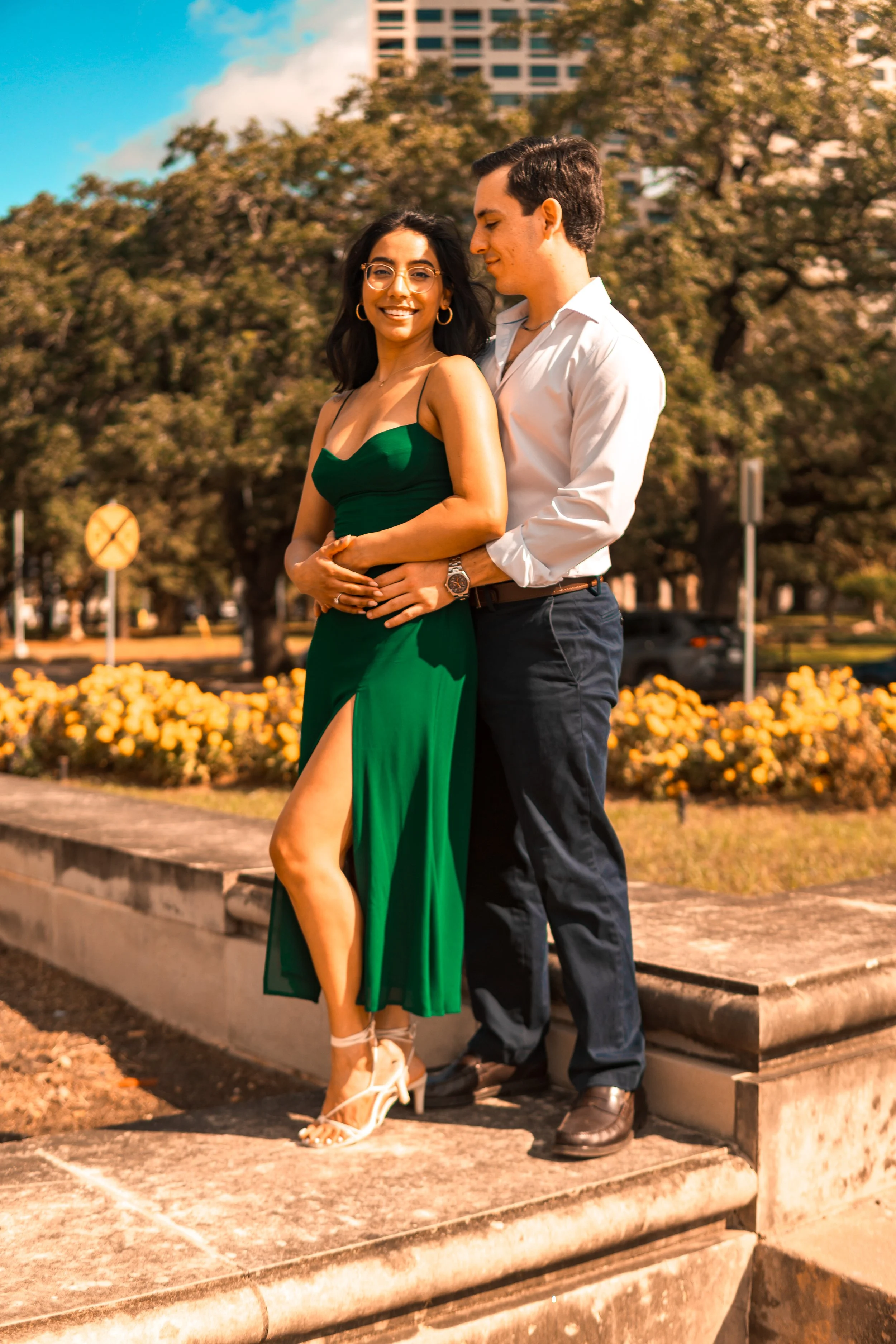 A engaged couple in Houston posing for a photo to be taken by a Engagement Proposal Photographer