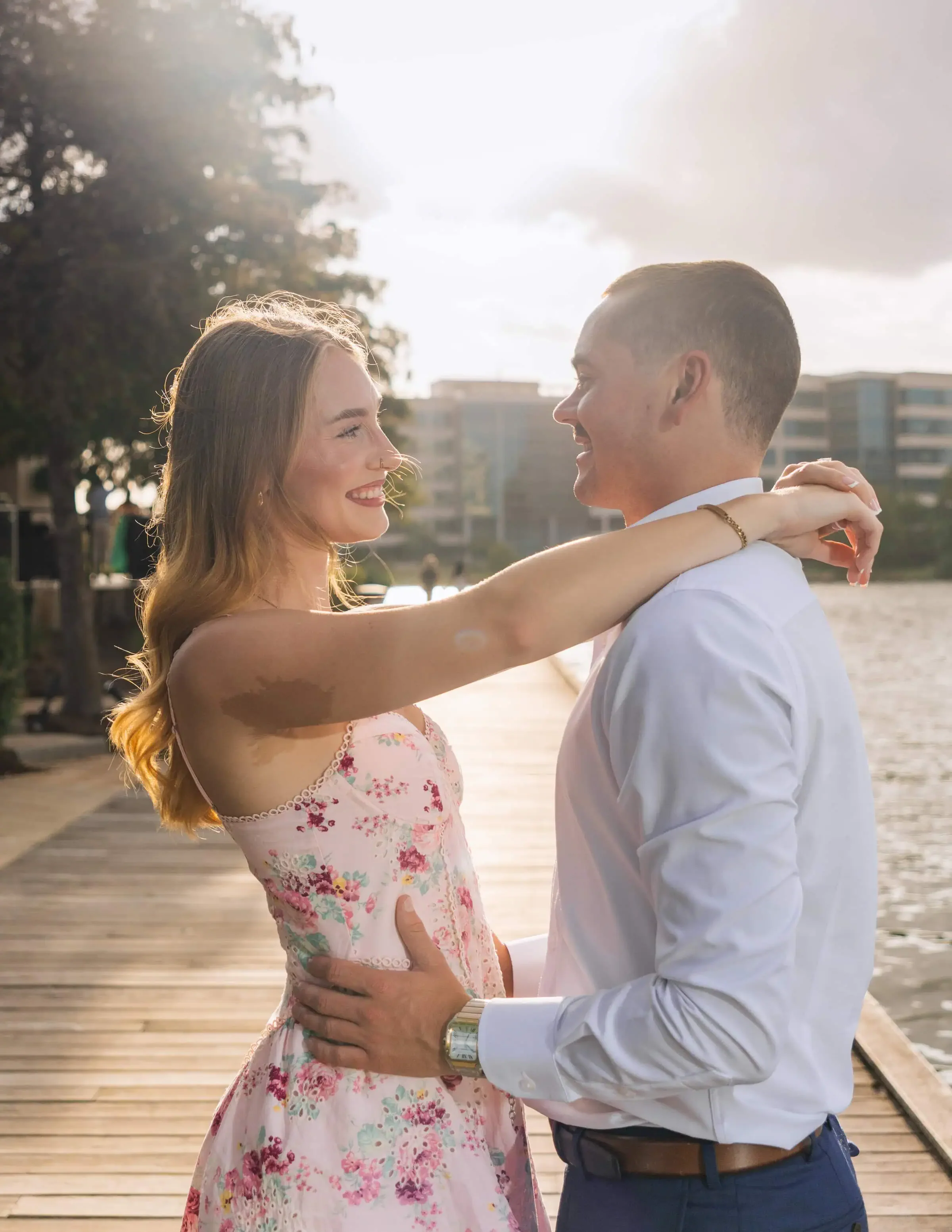 An newly engaged couple looking at each other for the engagement photoshoot in session in Houston.